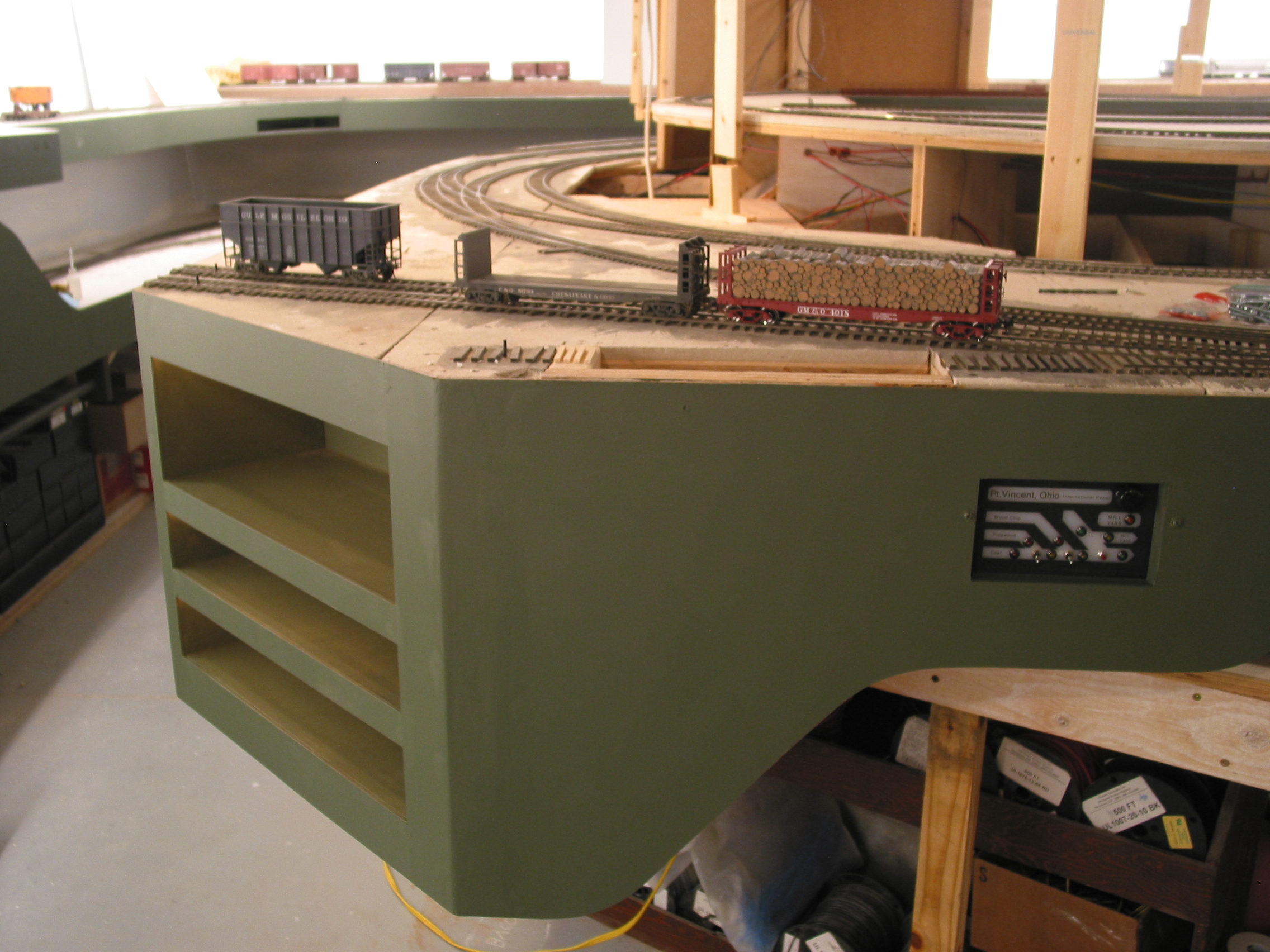  The finished Pt. Vincent work station with its removed-loads cubbies (lower two) and card file shelf (top). Rope lighting for night ops lights each one. Effort on the fascia helps provide a shadow-box effect for the railroad. 