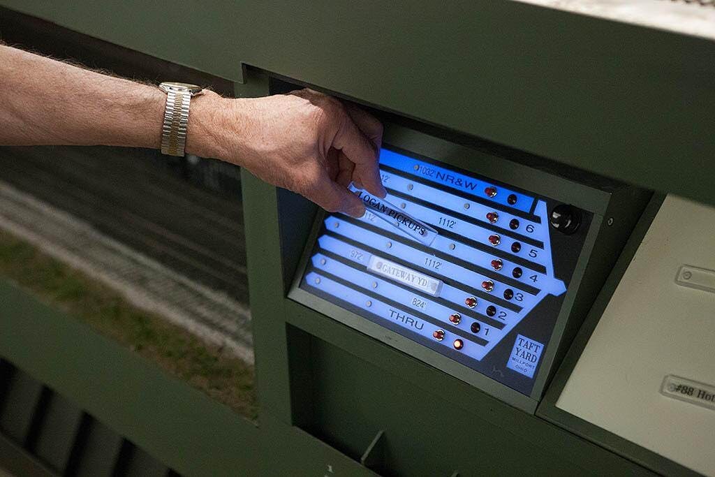  The panels can do more than control turnouts. They can also provide a place for train data. Keeping track of which train is in which staging yard track was accomplished using removable “Train Tiles”.  The tiles are held to the plex panel using magne