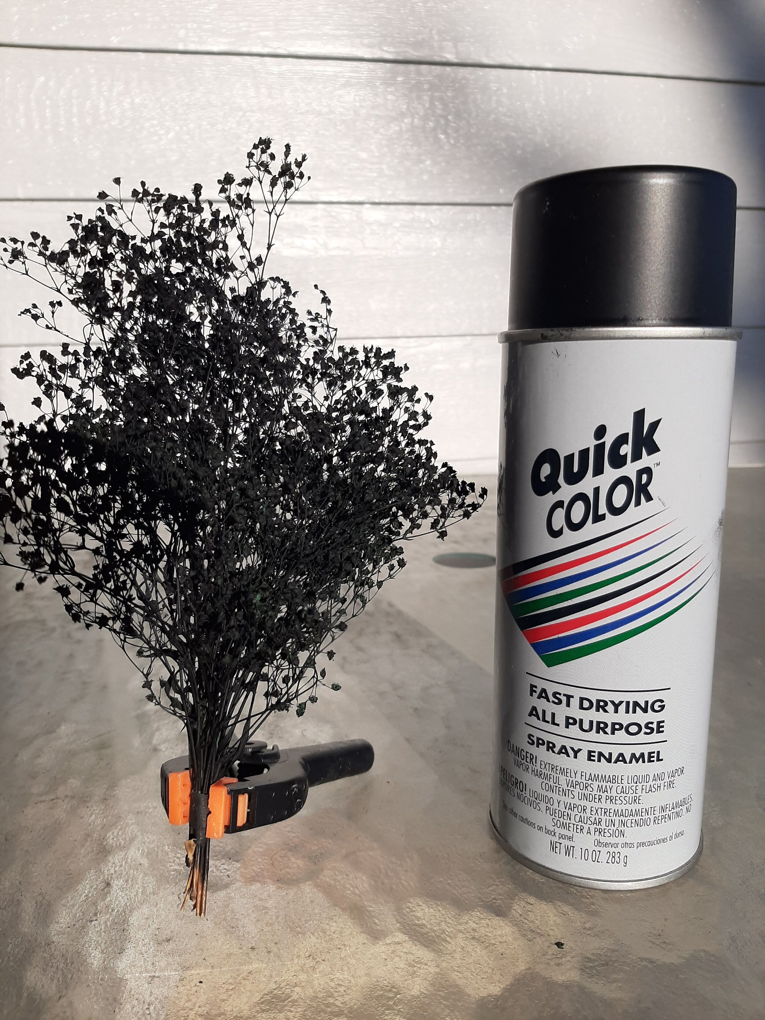  Next I spray the tree bundle flat black, making sure to spray the tape too. I buy the Quick Color at Home Depot for $.98 a can, and I buy it buy the 12 pack case!  