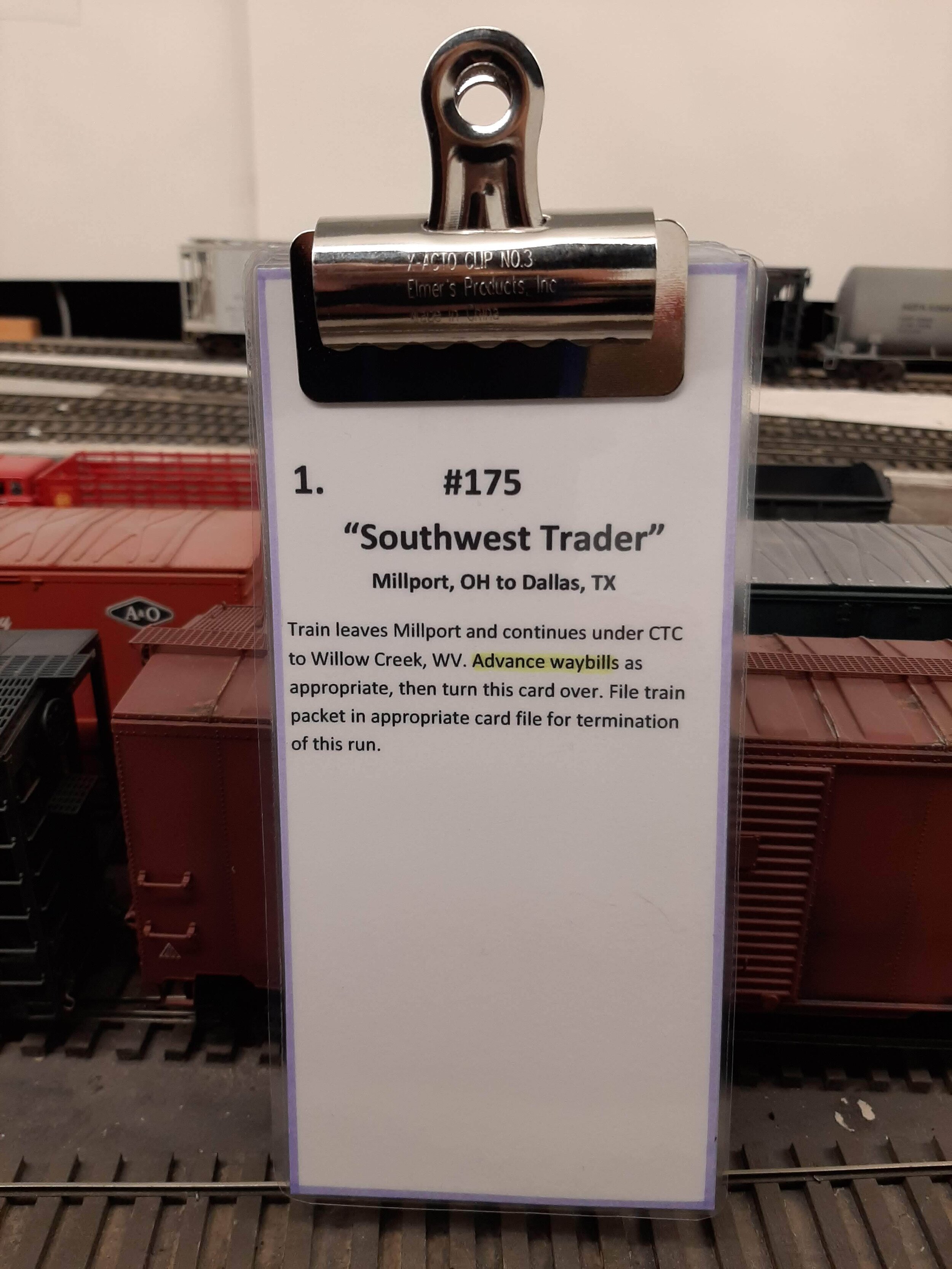  After sorting and pulling a string of cars for departure to Havens Yard, the caboose and motive power are added. A “Train Description Card” is placed on top and a bulldog clip holds the Train Packet together for the departing crew. 