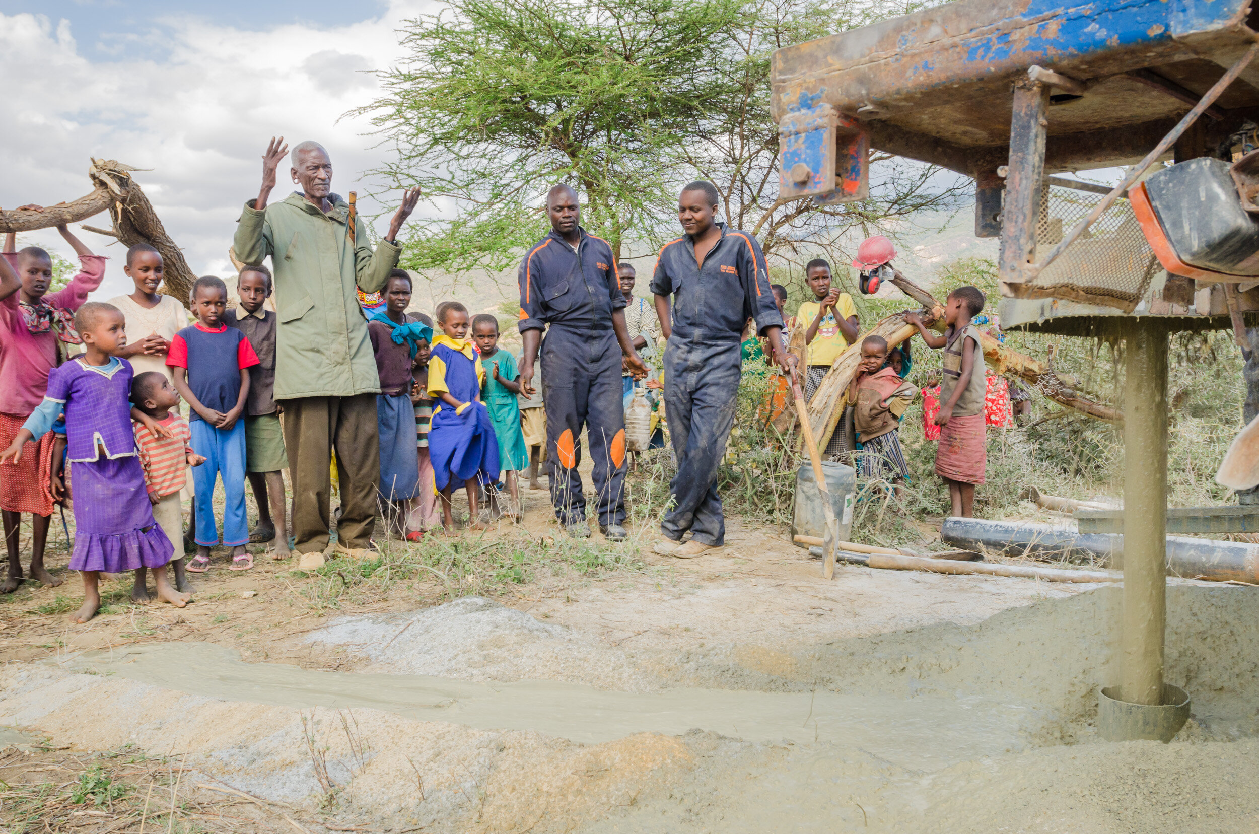 Praise from a village elder as the drillers finally reach water. Hopes for access to water are fulfilled. (Copy)