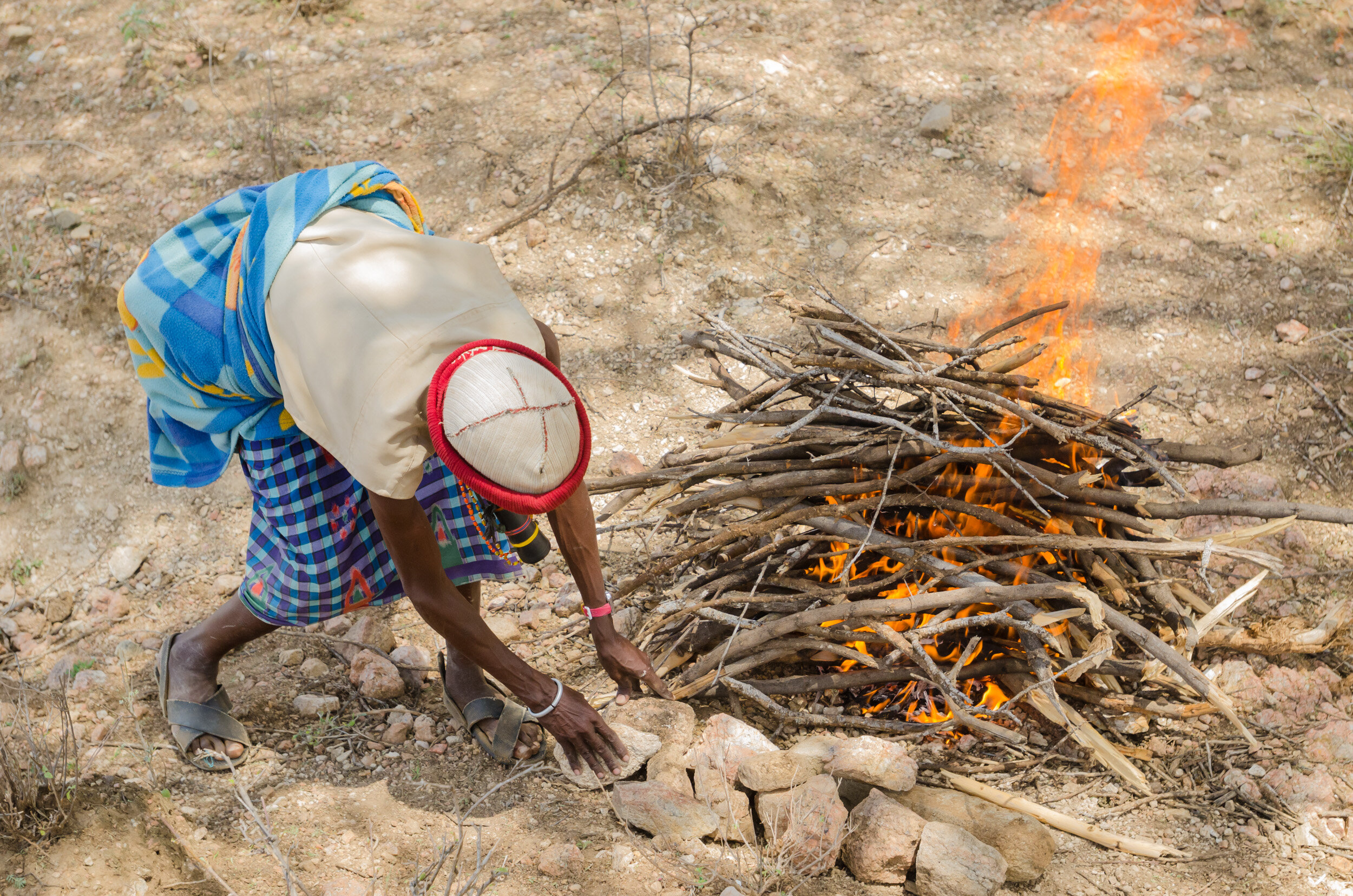 The men sacrifice and roast a goat. (Copy)
