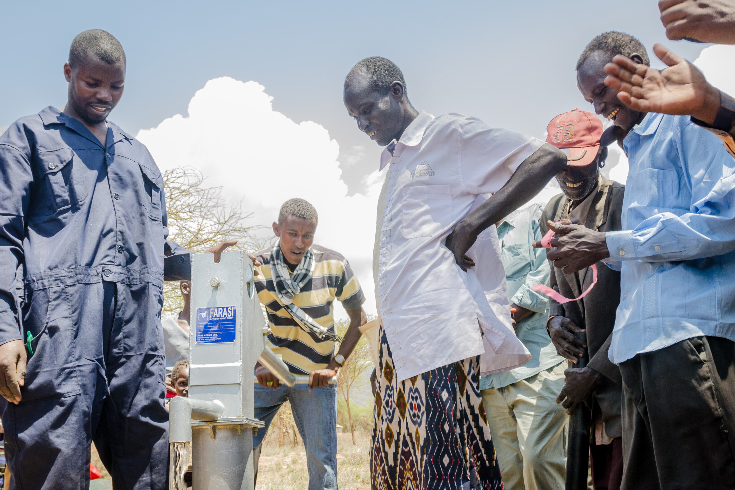 The first pumps of water from the well bring even more praise and joy. (Copy)