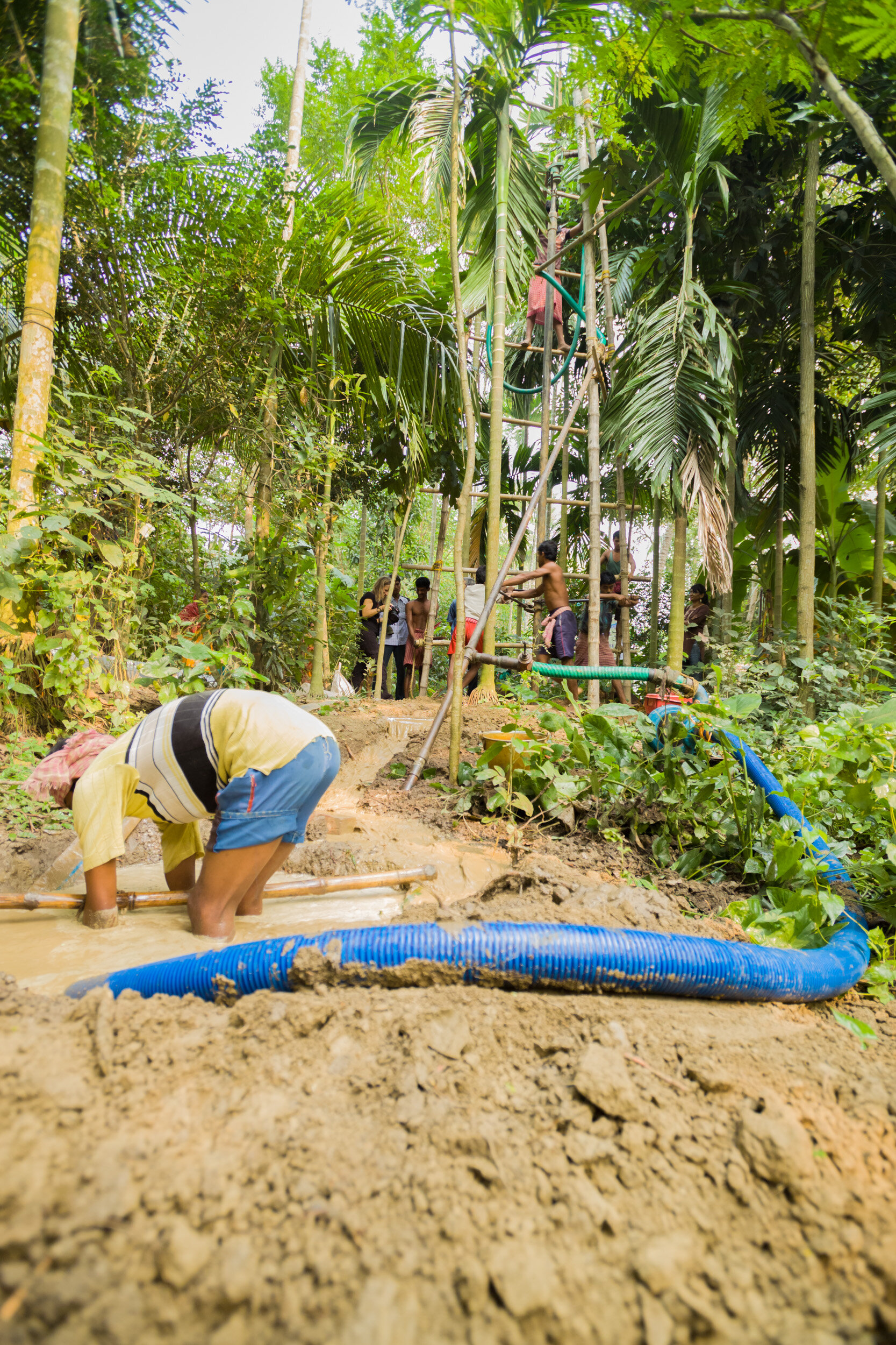The water pumped down the bore hole is recycled via a pump that suck the water back up from a reservoir also dug by hand. (Copy)