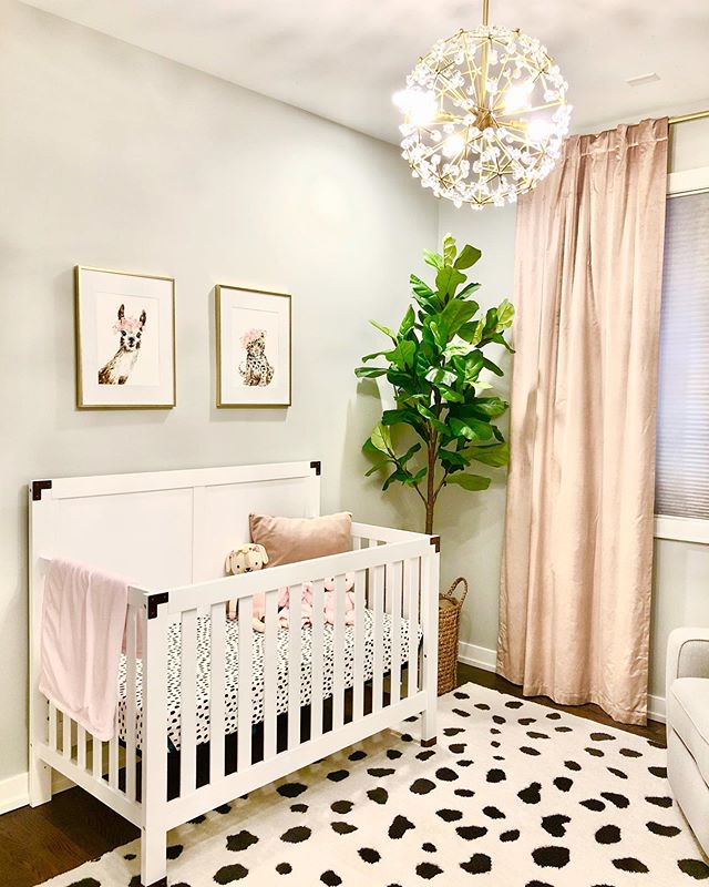 Just finished this blush &amp; gold nursery and am obsessed with the chandelier 😍 it really elevates the space! Design by @whittakerinteriors