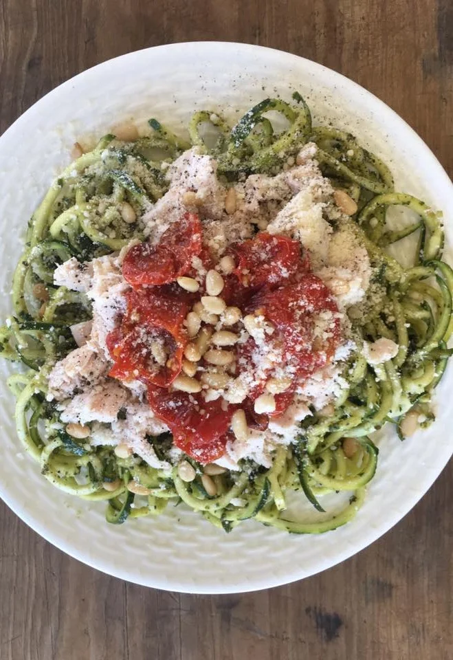 Zoodles w/ pesto, leftover chicken, pine nuts, roasted tomatoes and a sprinkling or Parmesan.