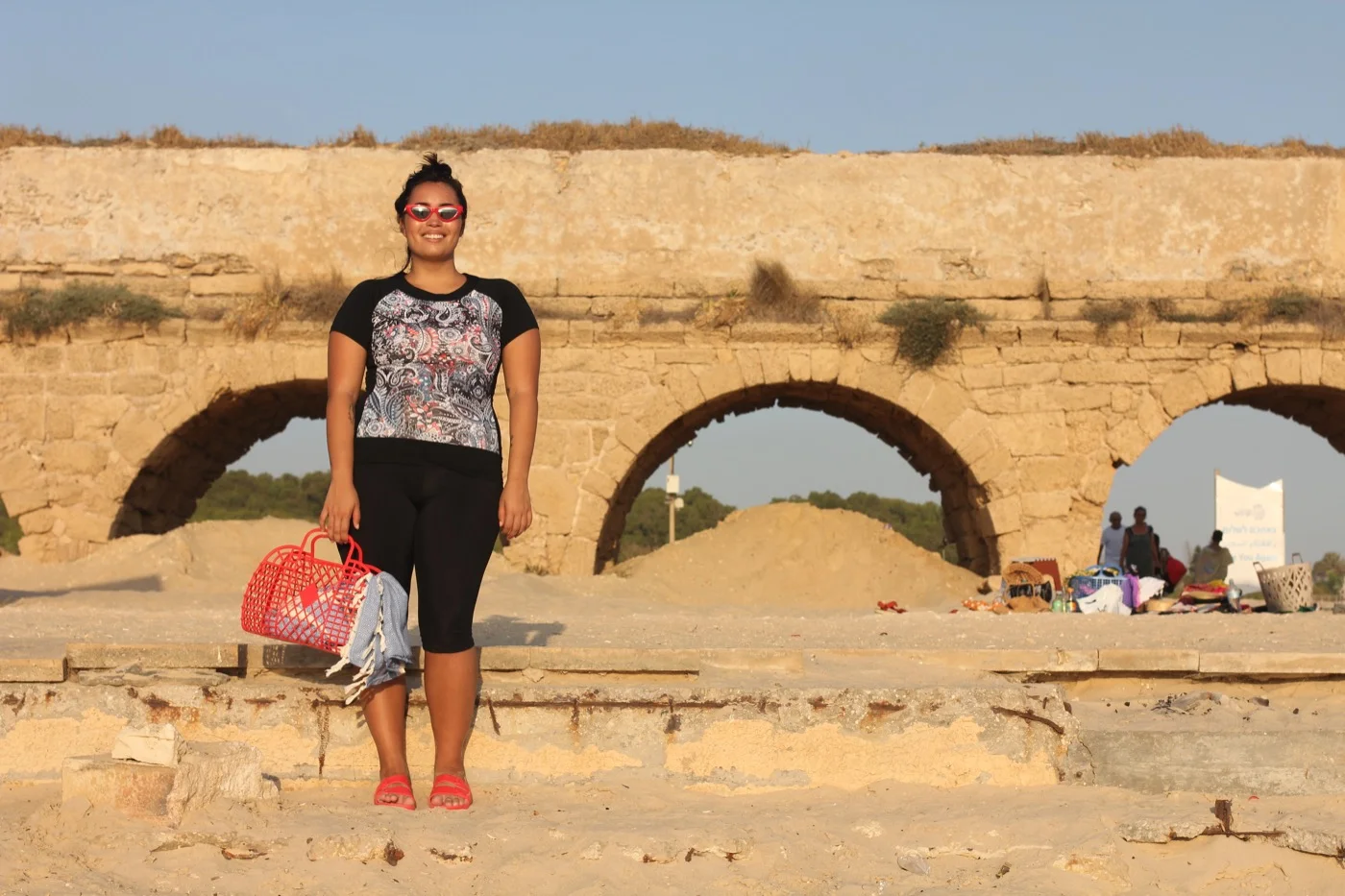 Hannah wears Red sunglasses, Top Ten , Rashgaurd top and pants (top came with match skirt and pants), HydroChic , Bag, Sun Jellies , Turkish towel, stylists own, Sandals, Freedom Moses