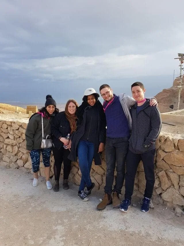 Shekhiynah with her fellow birthright participants an IDF soldiers atop of Masada