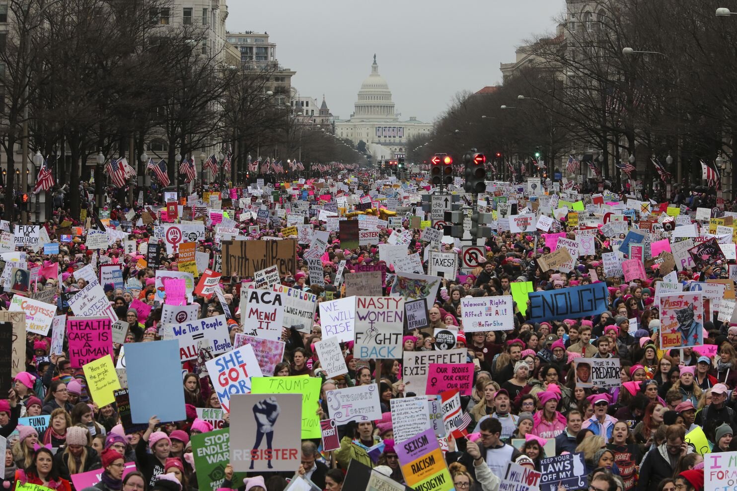 With the Capitol in the background, a crowd fills a street in the District during the Women's March on Jan. 21, 2017. (Oliver Contreras for The Washington Post)