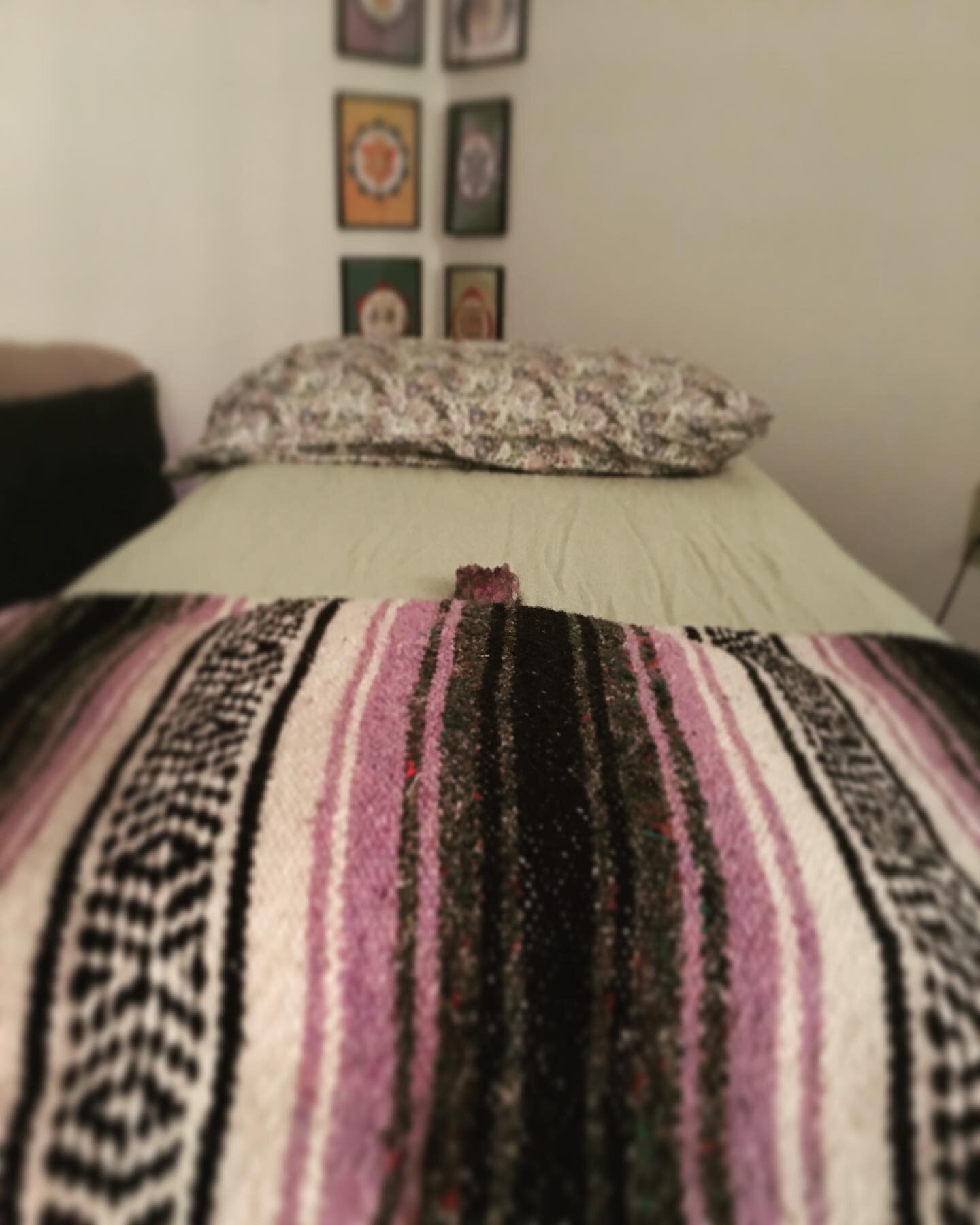 View from the table....Chakra art in the frames. Amethyst charging before polarity therapy session. Pillow to support the knees or feet.✨ #elementalrootsgnv #massagetherapy #polaritytherapy #gongbaths #yoga #meditation #thaimassage #houseofyingnv