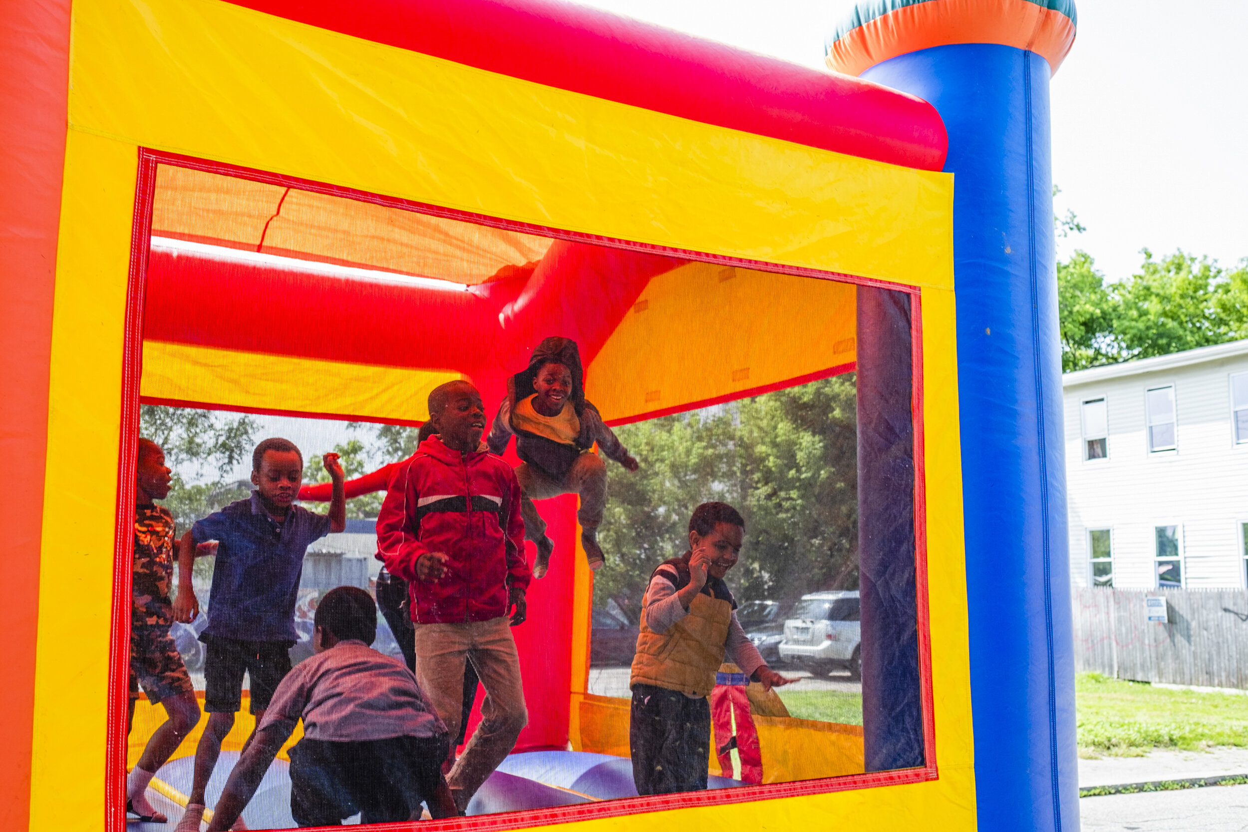  Children play in a bounce castle rented by the Refugee Dream Center  