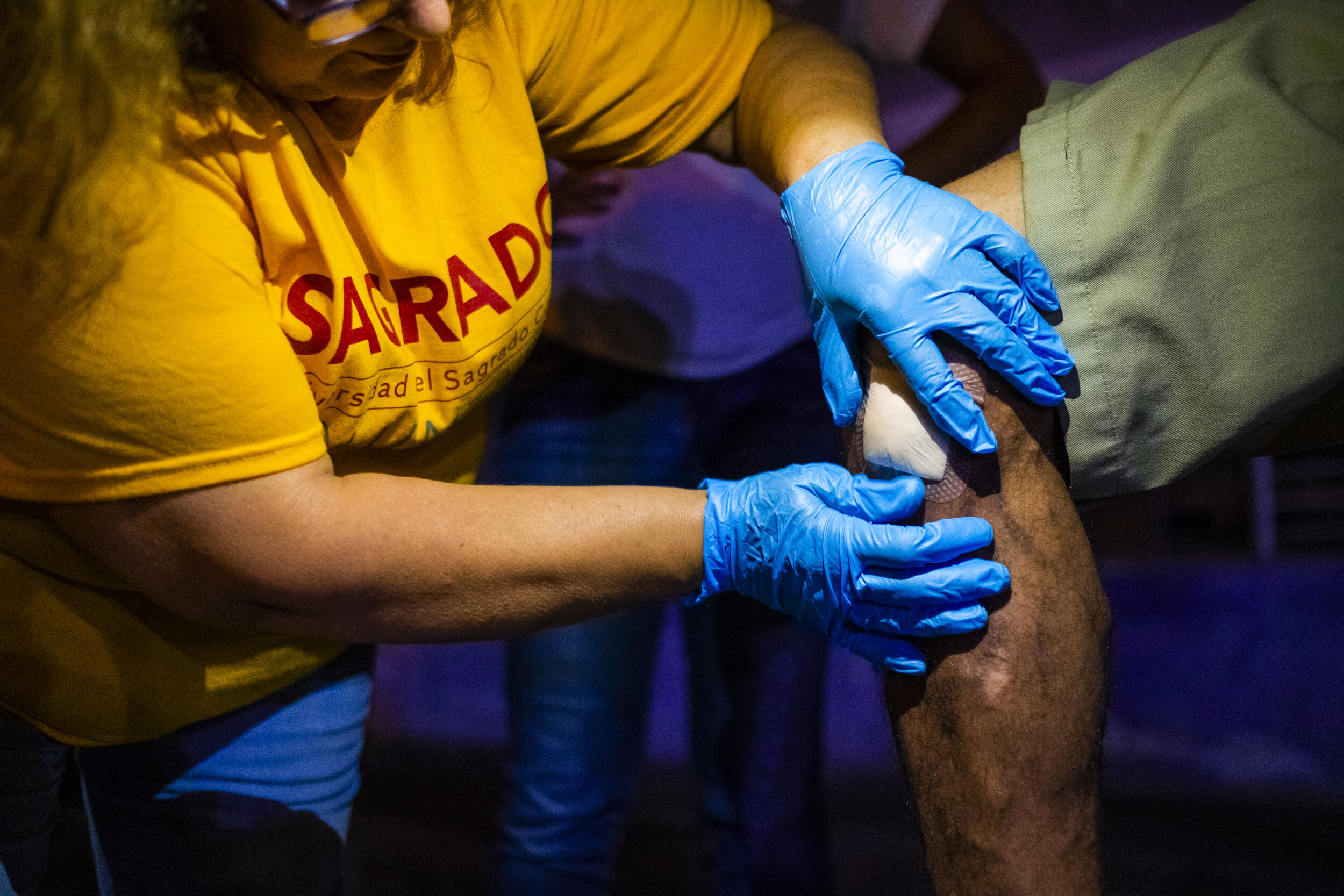  A visiting nurse from Spain volunteers to clean and bandage sores resulting from opioid injections, such as Fentanyl. 