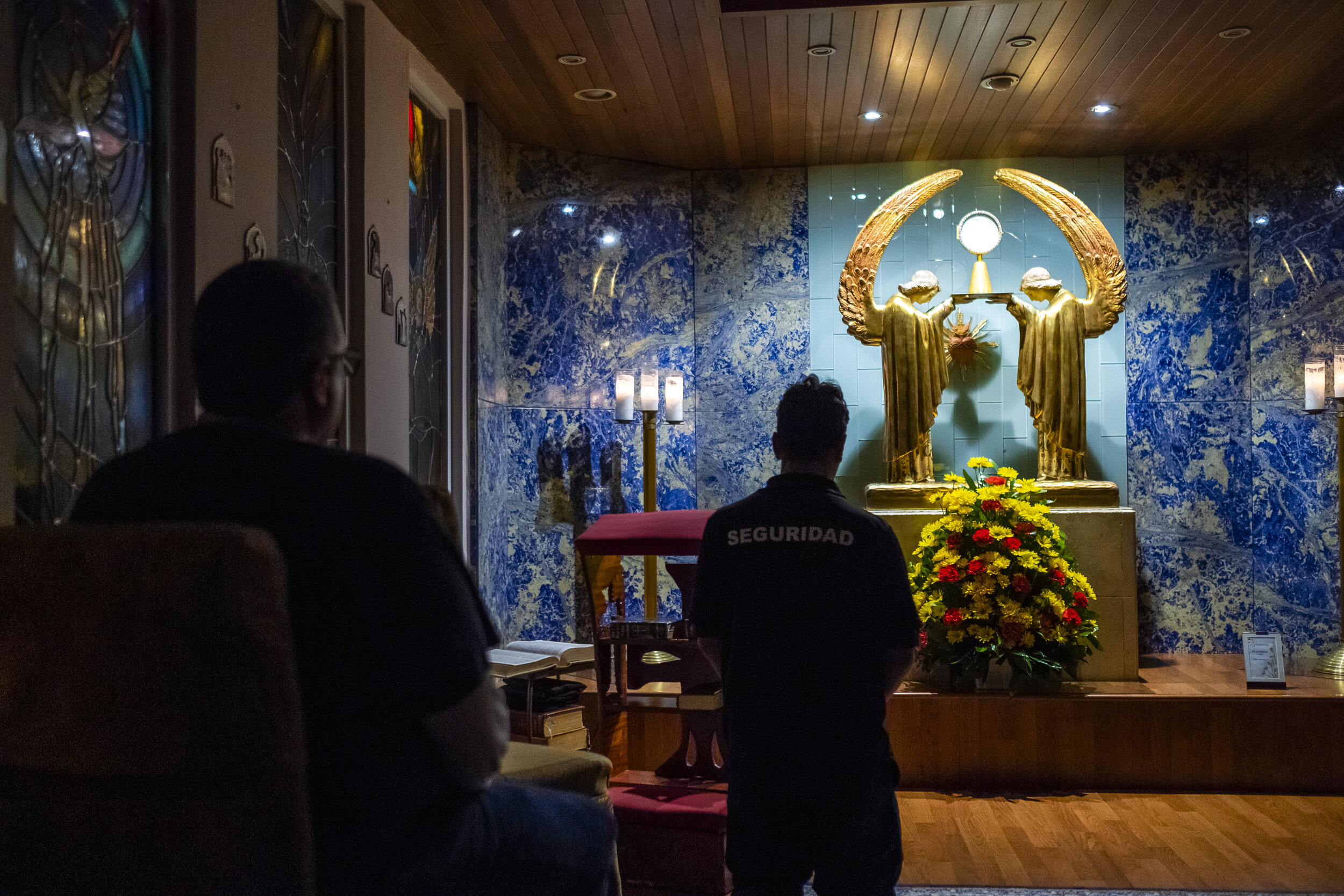  The team of Operación Compasión makes a pit stop at a local chapel for a moment of meditation, half way through their night route schedule. 