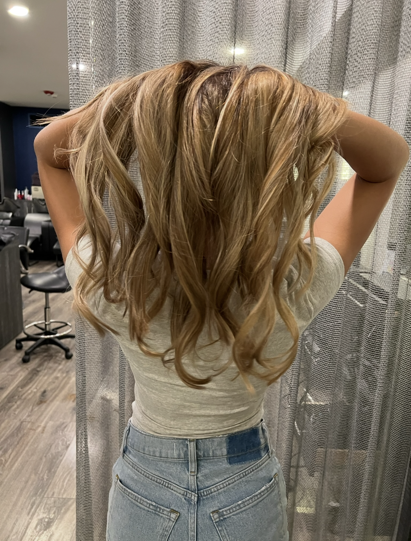 Hand-painted blonde balayage highlights at Salon Sapphire Clarendon Hills