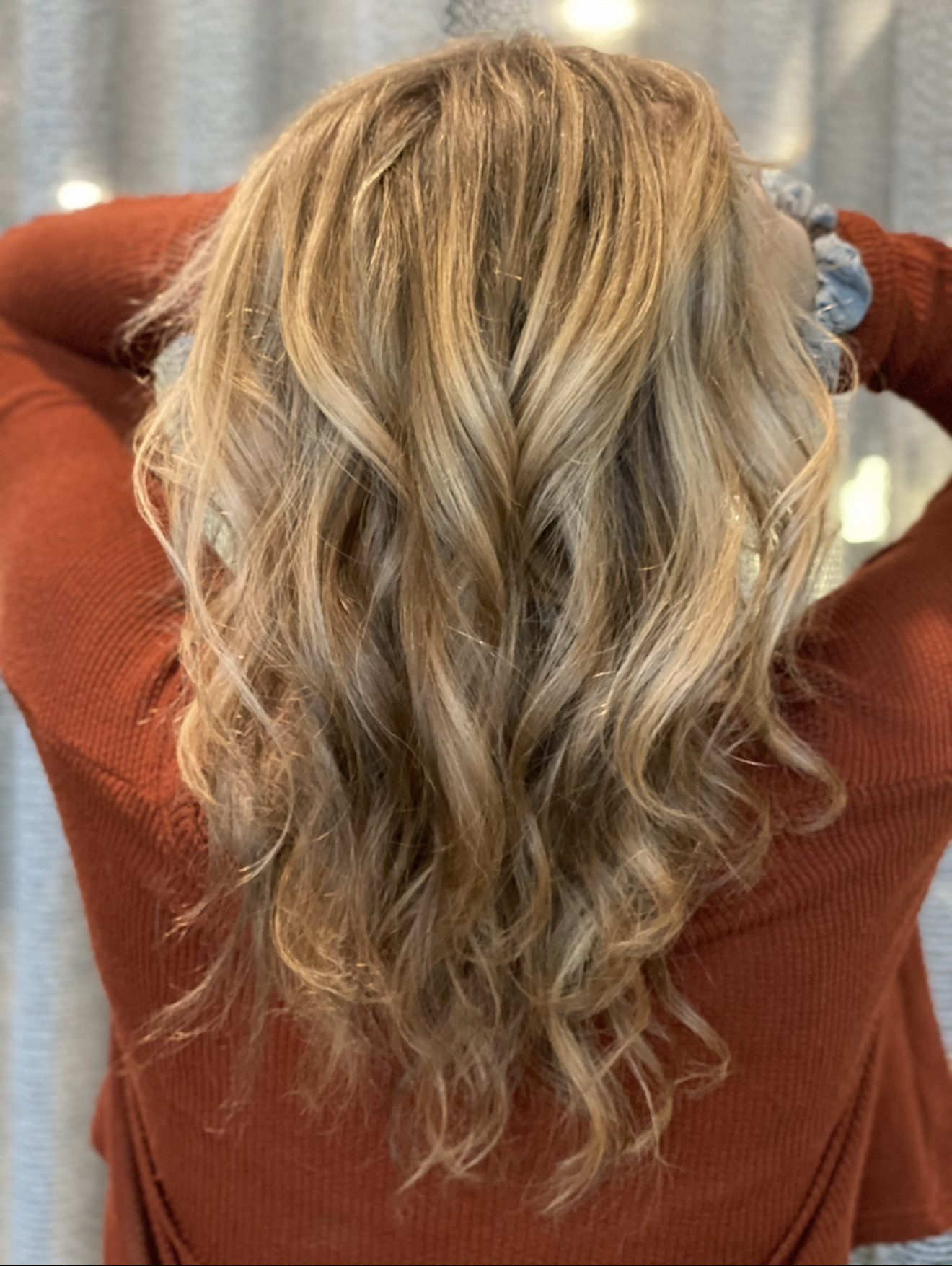 Cool-toned blonde balayage with beach waves at Clarendon Hills salon