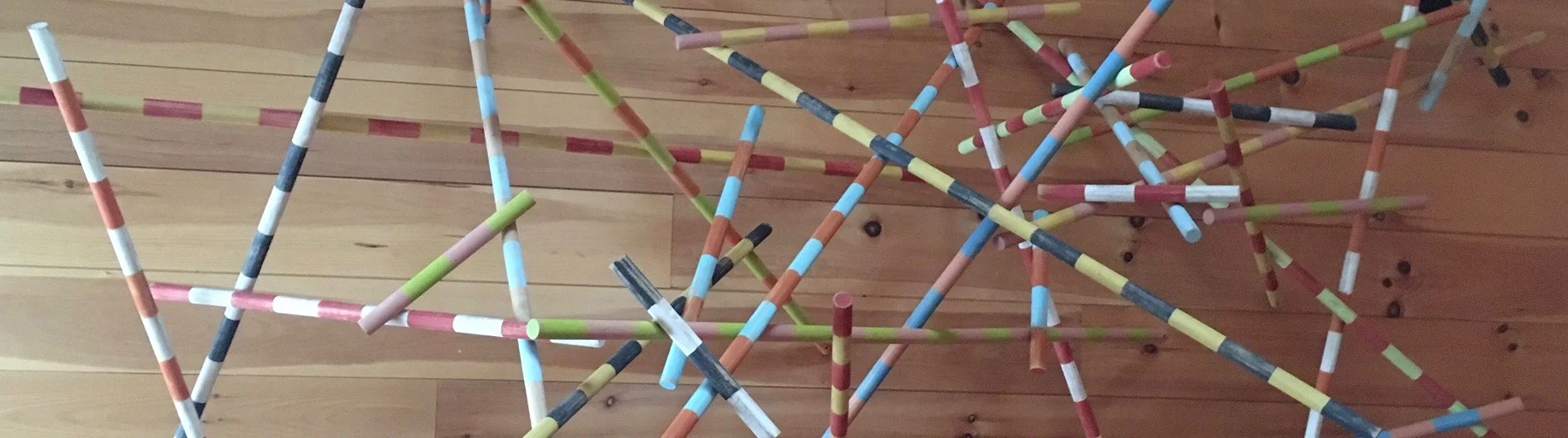 Detail of 'banded poles' by paul oberst. acrylic on wooden dowels manufactured at the mill. this sculpture is on display in the kitchen of the mill school.