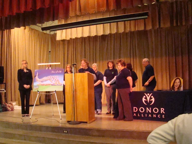 Jennifer Moe of Donor Alliance organized the first-ever floragraph finishing event, enabling Jill Connett's portrait to be completed in Denver by her mother Melody and Carol, the recipient of Jill's liver. Overwhelming media interest set the stage for rapid expansion in future years. (Photo: Donor Alliance)