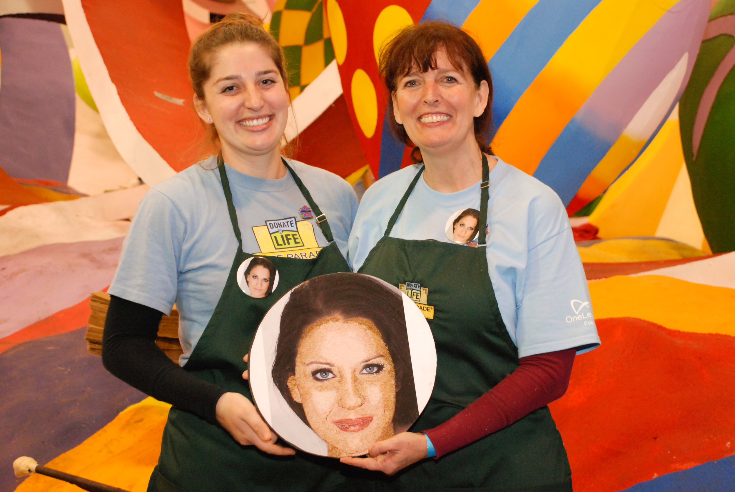 Lindsay and Lynne Frutchey decorated the floragraph of Alexis Lucia Scanlin prior to anchoring floragraph touchup. (Photo: Luis Ramirez)