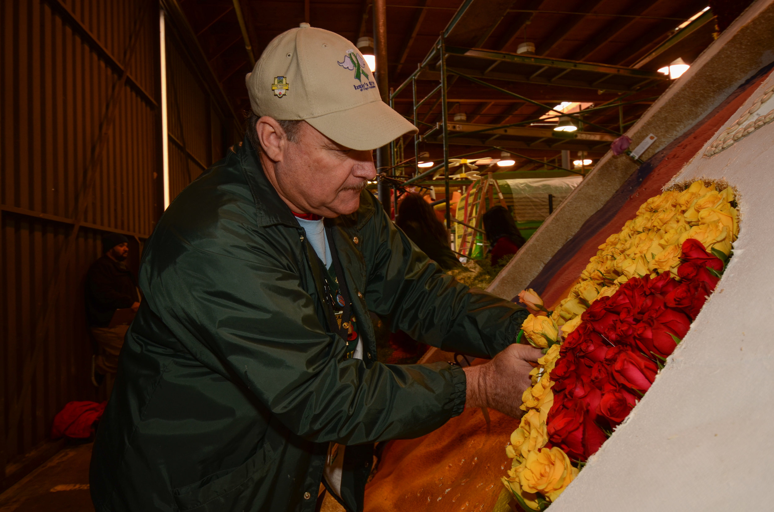The tribute to the victims of the Sandy Hook shooting took the form of twenty red rose buds protected by six full-size blooms, each of which bore one victim's name on its tag.(Photo: Luis Ramirez)