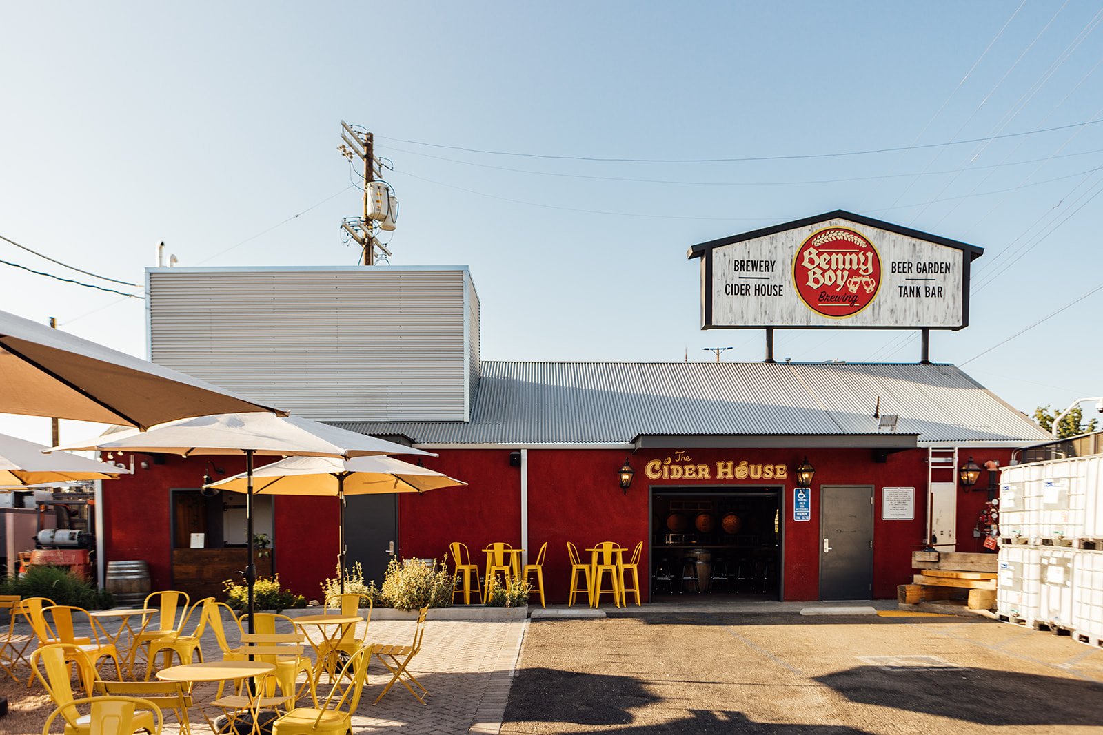 A view of the whole cider house with the tall Benny Boy sign above it