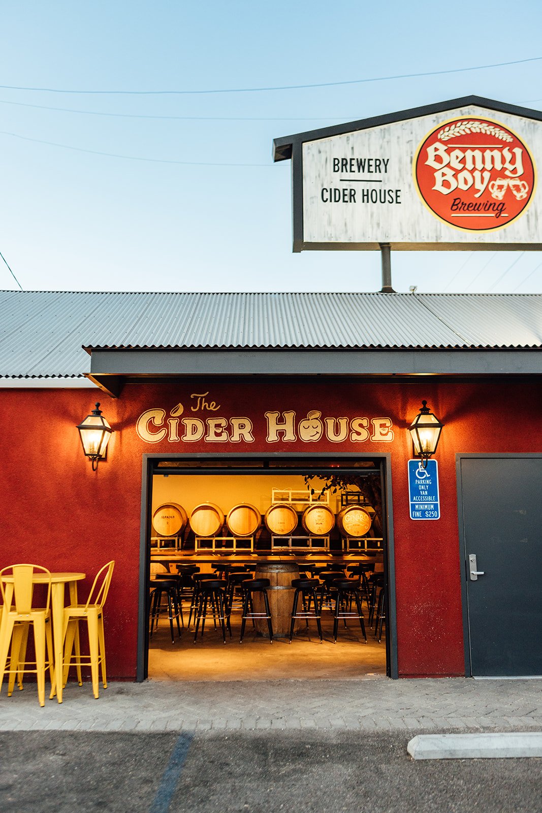 A view of the cider house building with the garage door open