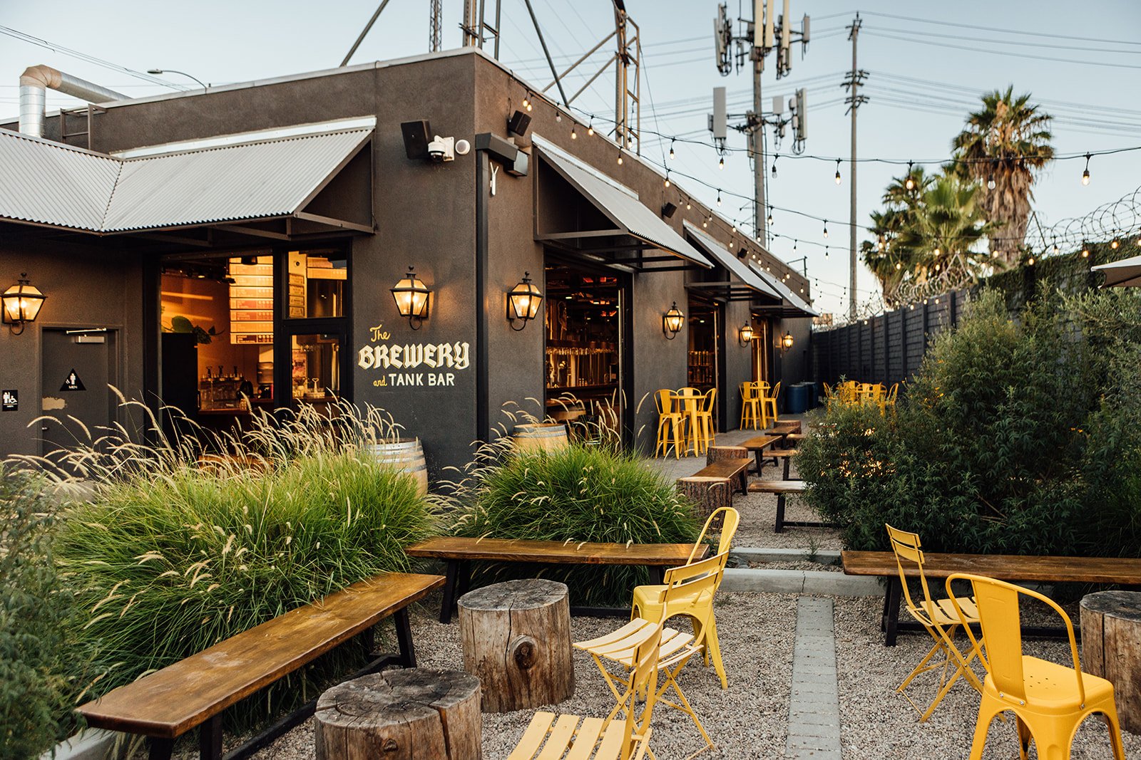 An angle from the beer garden facing towards the back corner and fire pits