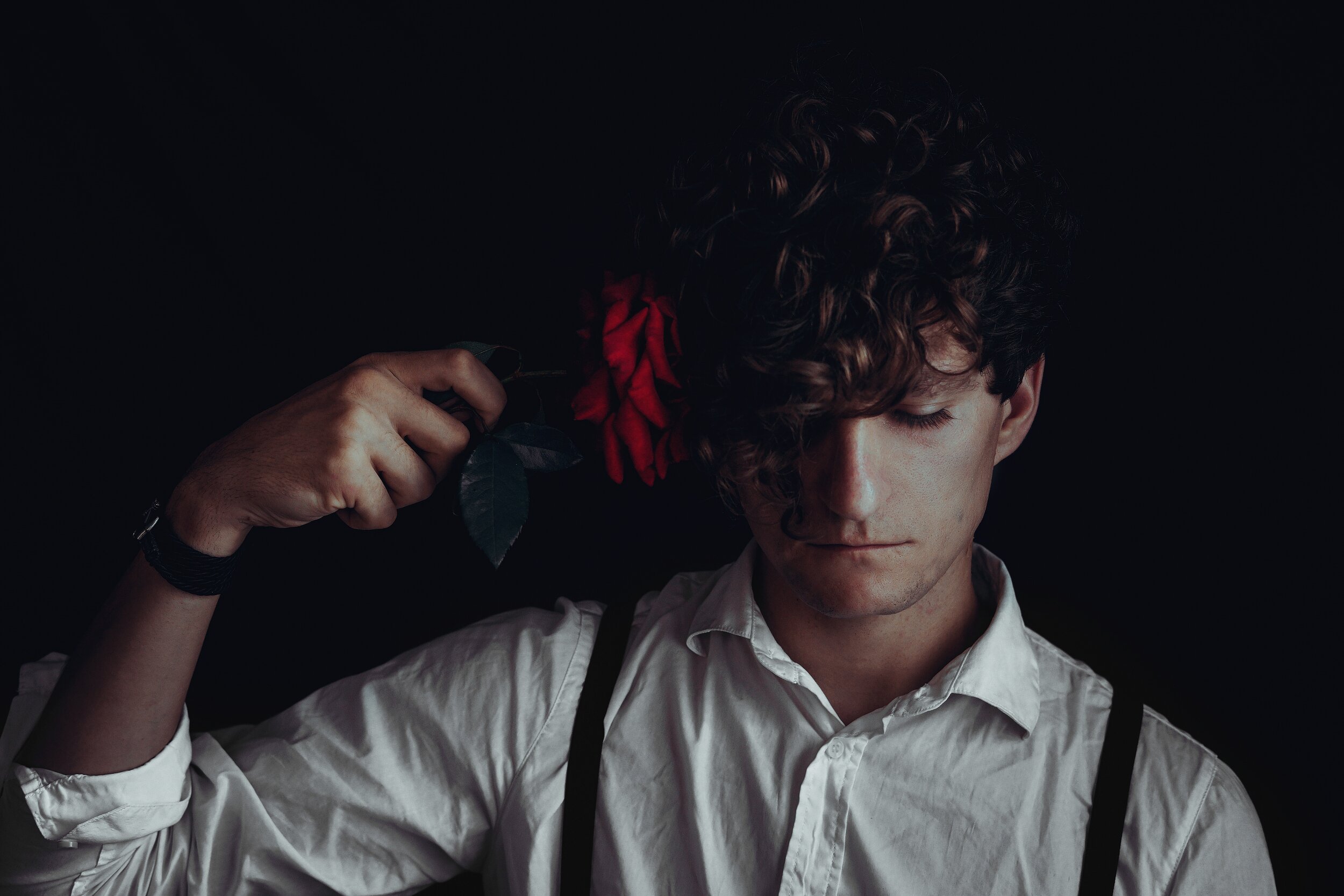 man holding a flower .jpg