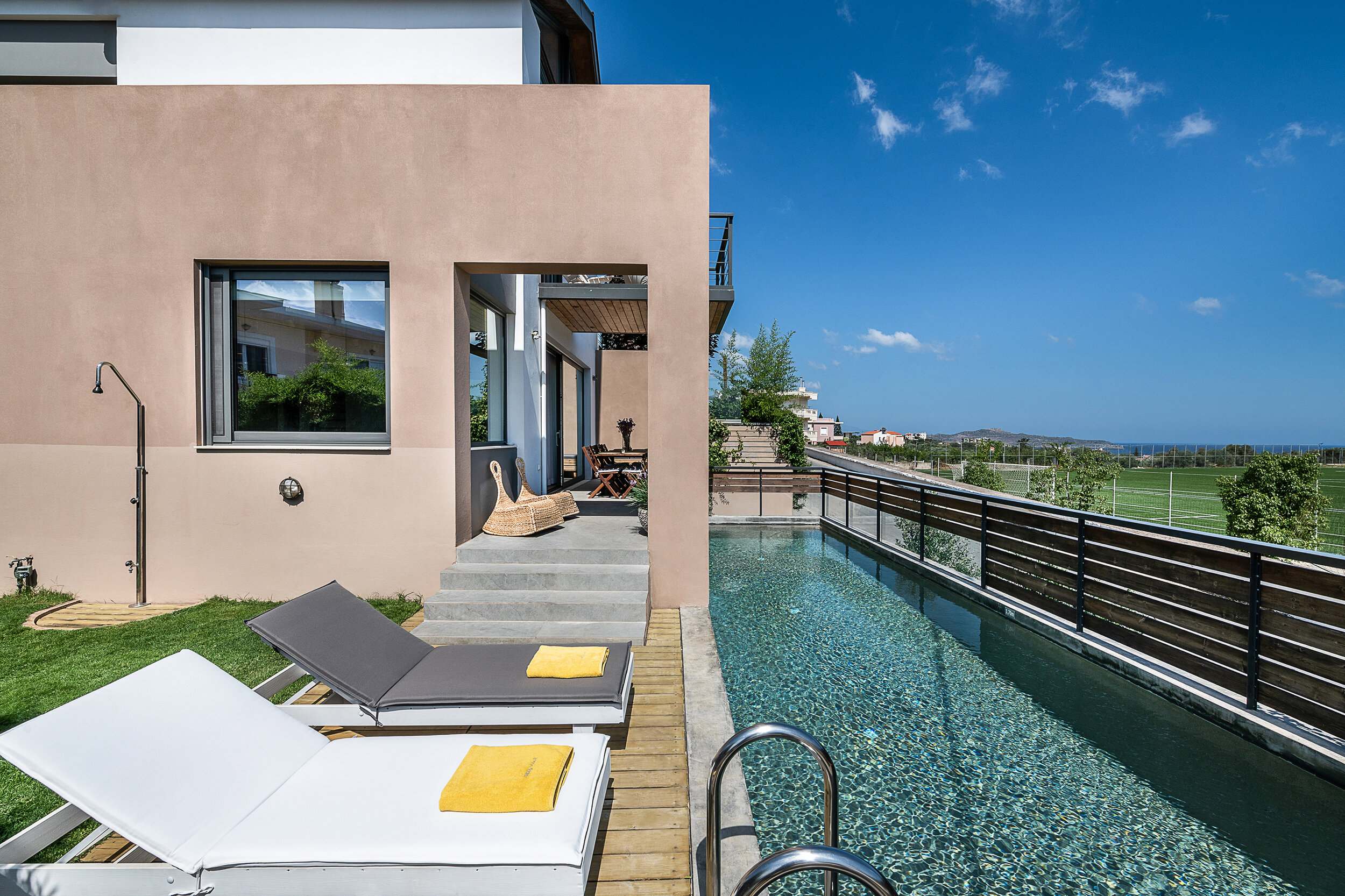 heated swimming pool with sun deck and sun loungers