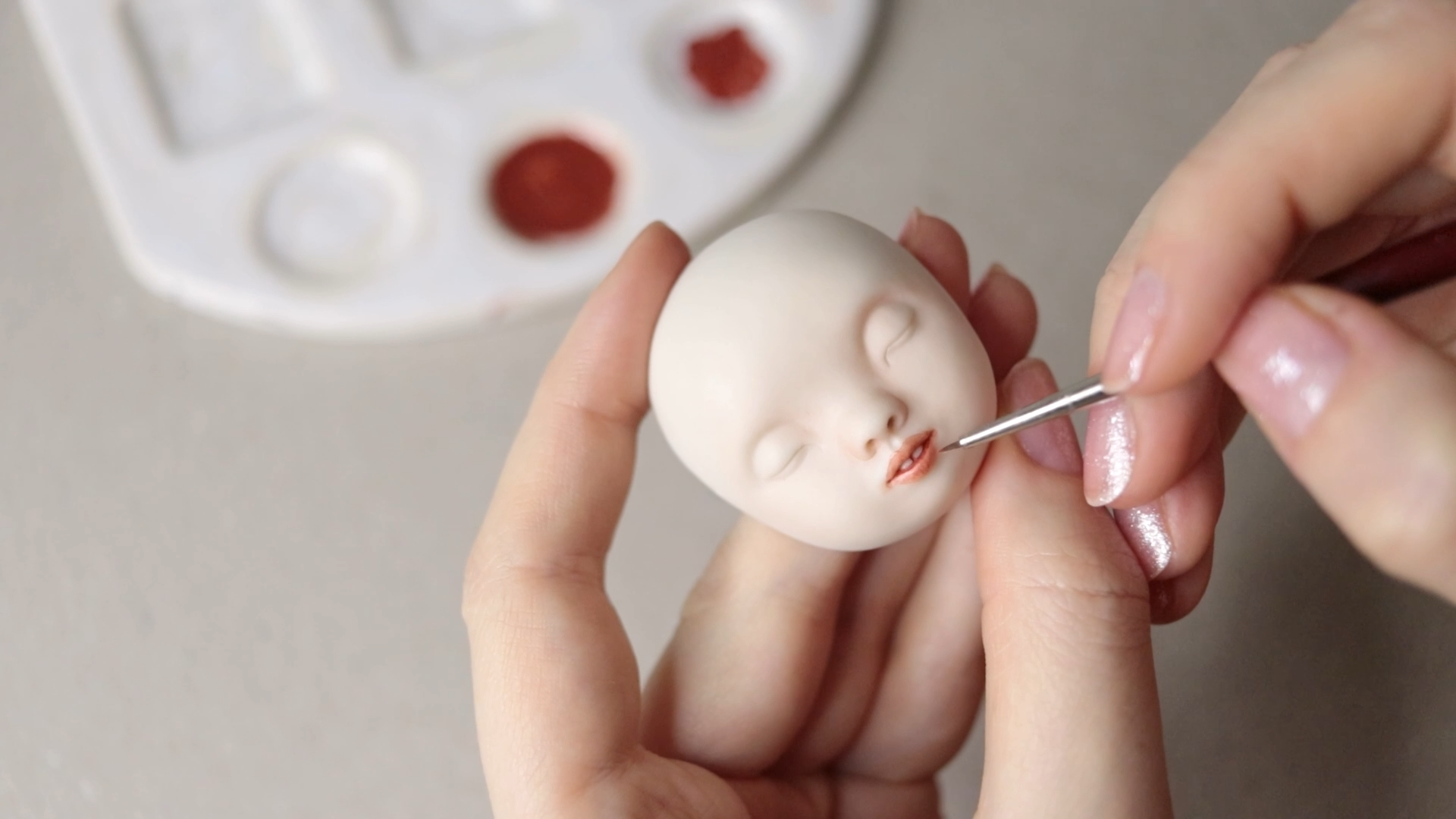 Painting the faces with china paints