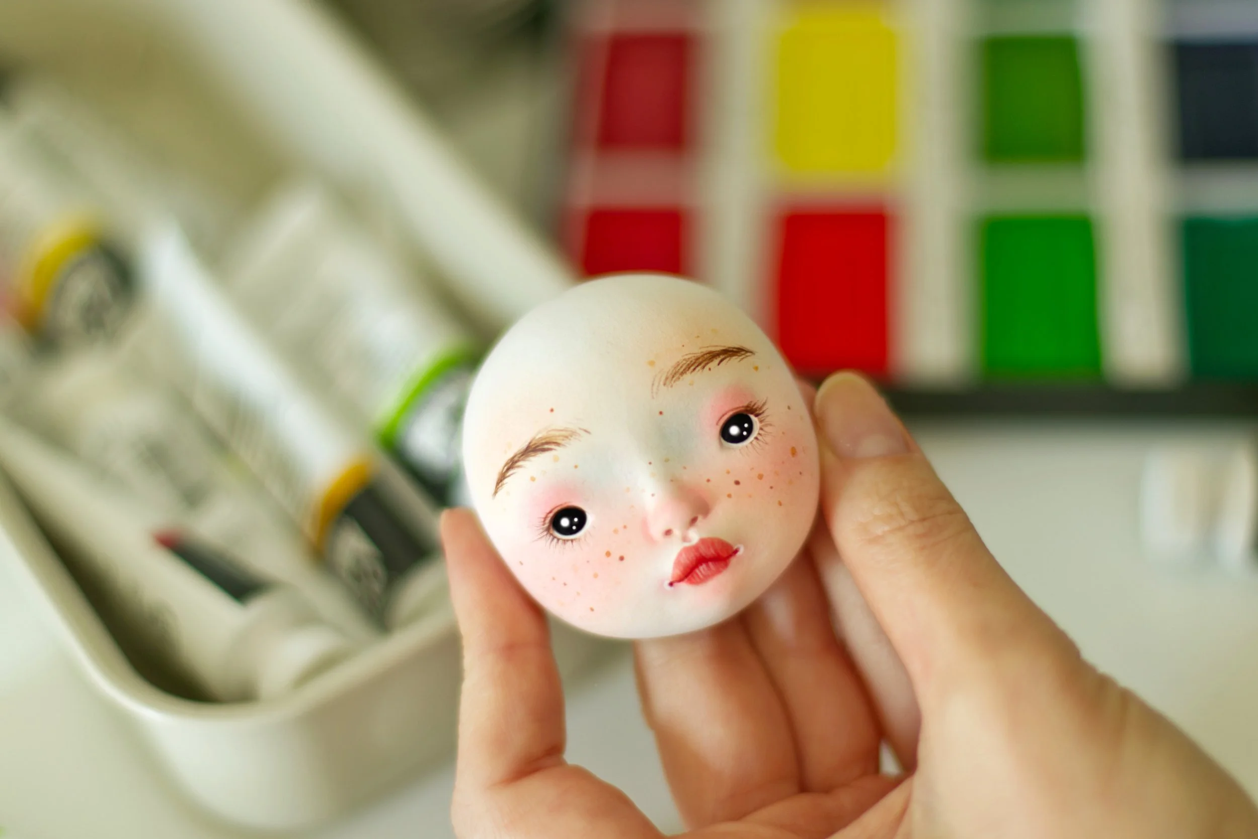 Painted face of art doll by Adele Po.