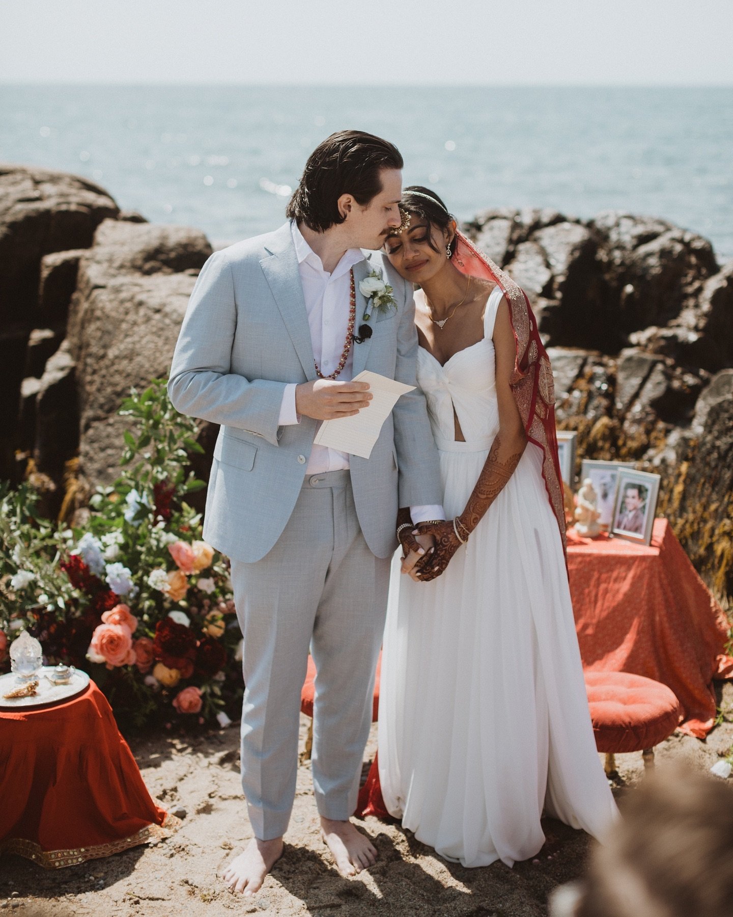 Avani and Will embracing at the start of their incredibly intimate ceremony on the coast in Westport, MA. We cherish every opportunity to work on the water in this little corner of the country we&rsquo;ve come to call home.