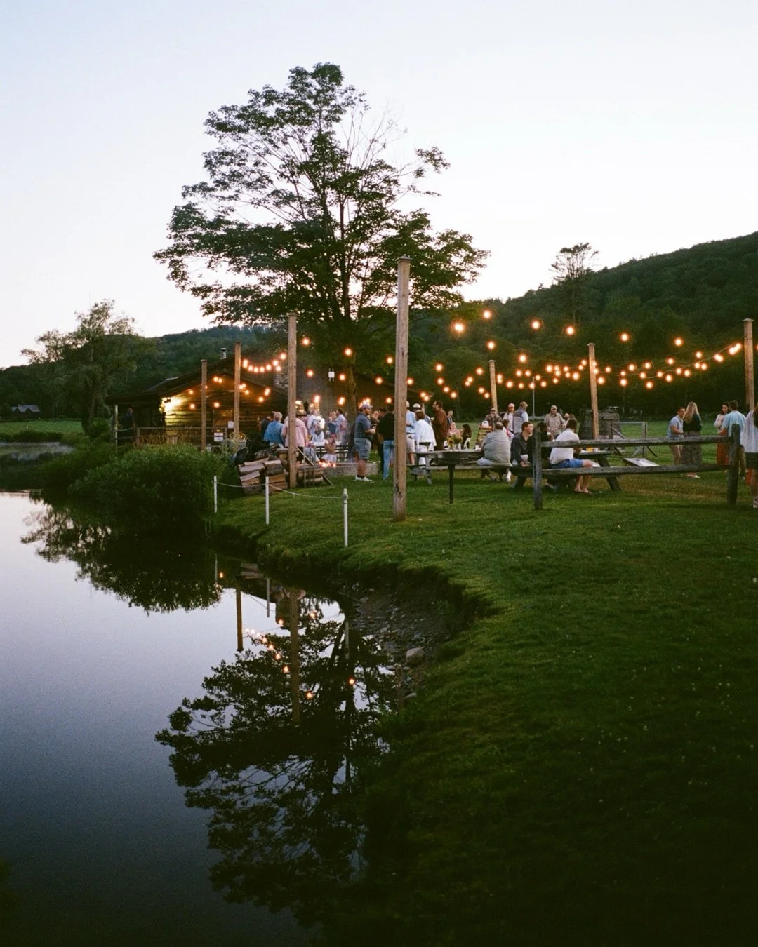 Warm summer night memories from Emily &amp; Landon&rsquo;s welcome party at the Grafton Inn, made magical by the sky&rsquo;s transition to blue hour &amp; cafe lights, bonfire and smores, and most of all the biggest hello hugs and so much joy and ant