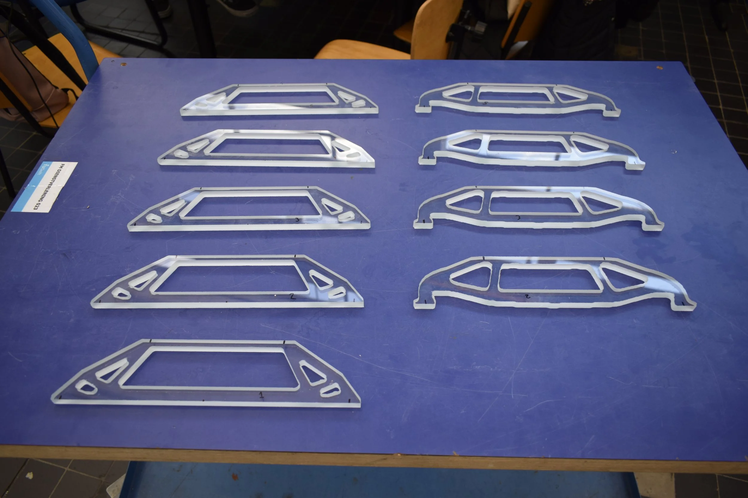  For this research, several optimization algorithms for structural glass were used to design a beam for a 4-point bending load case. The resulting geometries were cut from float glass using a waterjet cutter for physical testing. 
