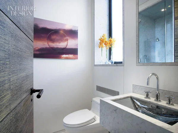344847-The_powder_room_s_cantilevered_marble_vanity_contains_a_nickel_plated_sink_Photograph_by_Eric_Laignel_.jpg