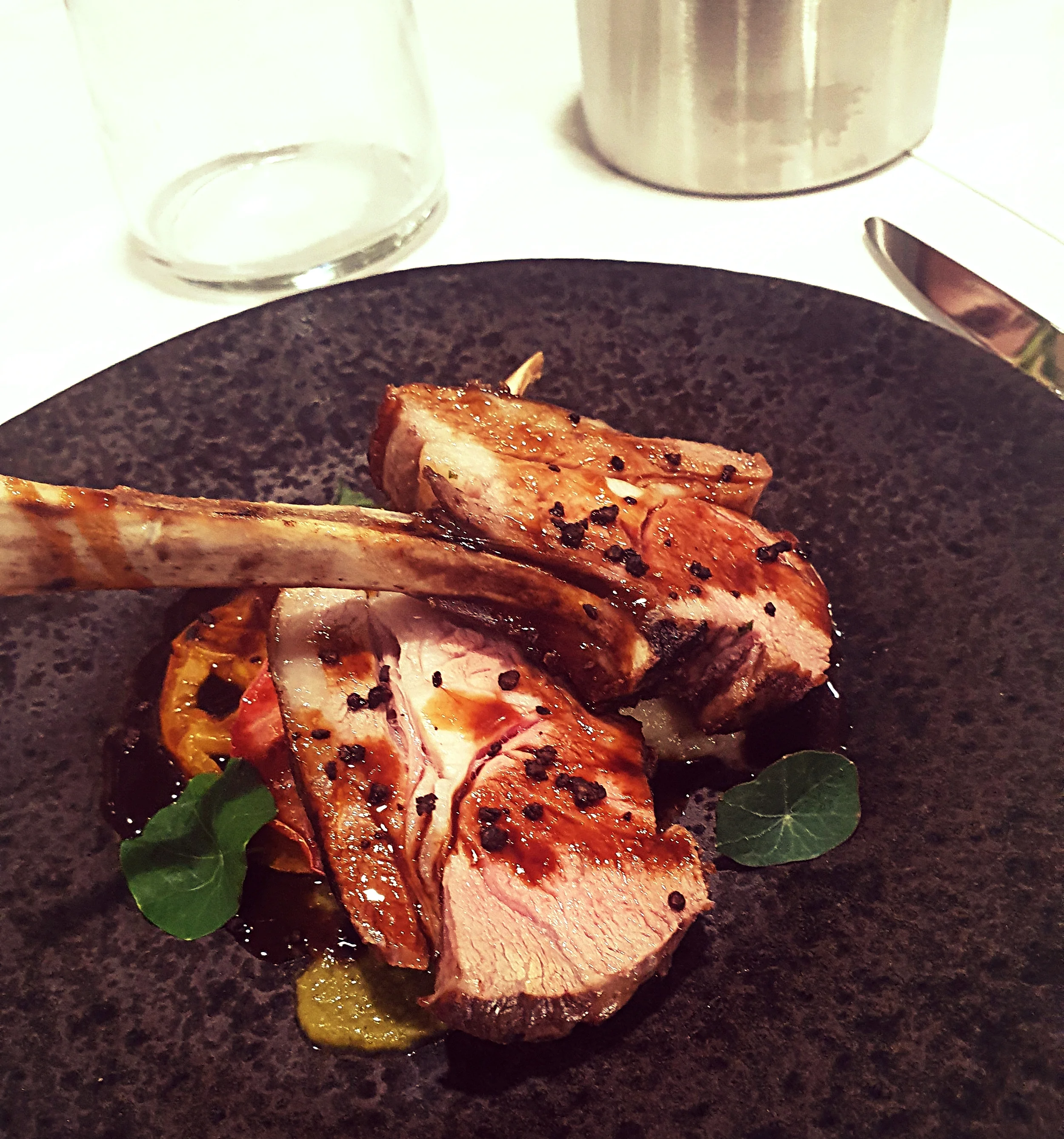 Roasted rack of lamb, celeriac discs, courgette and basil puree
