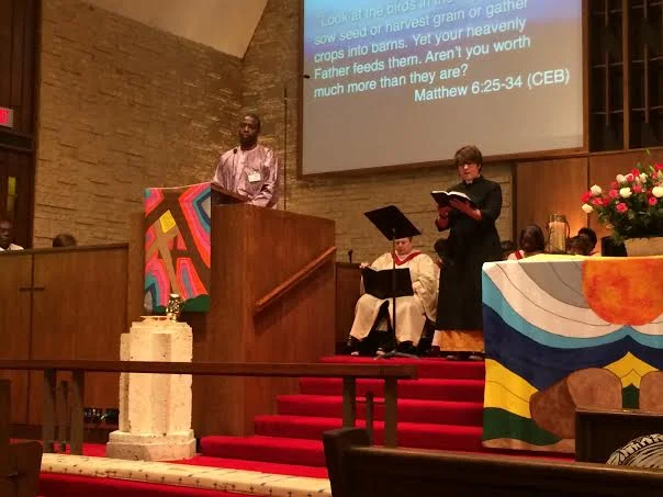 Thony Ngumbu preaches in Swahili and Rev. Hannah Terry preaches in English.