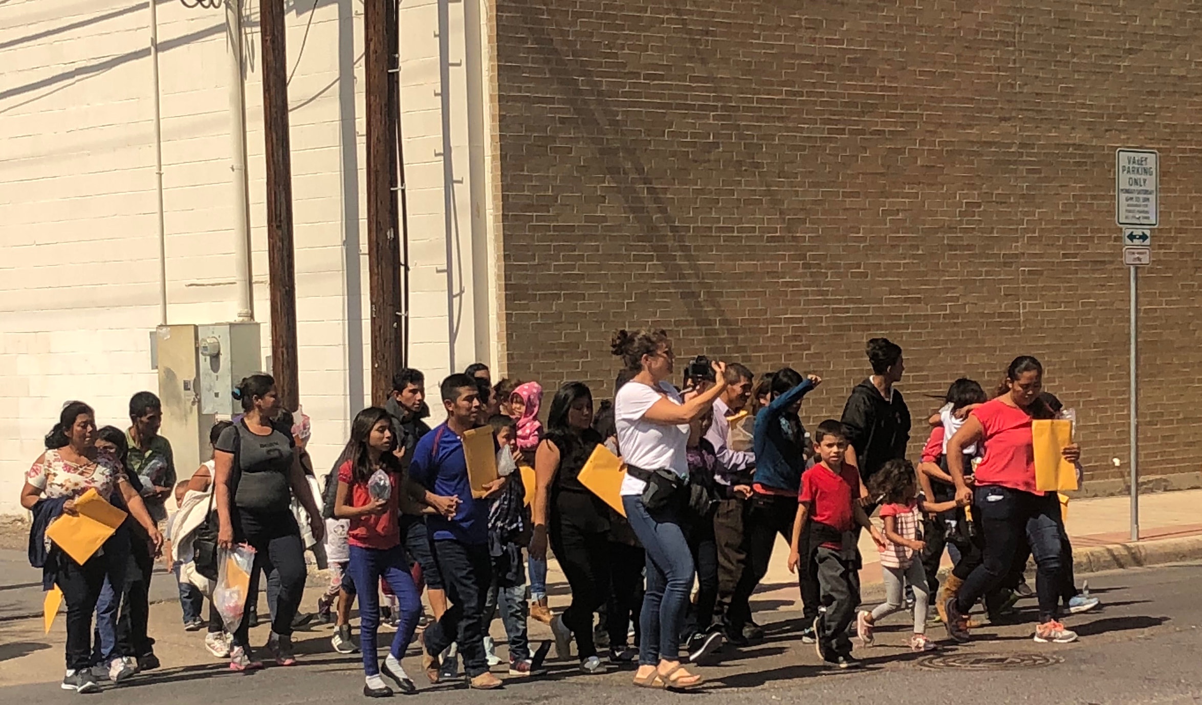 Catholic Charities walking with our neighbors — photo taken in McAllen TX at the bus stop.