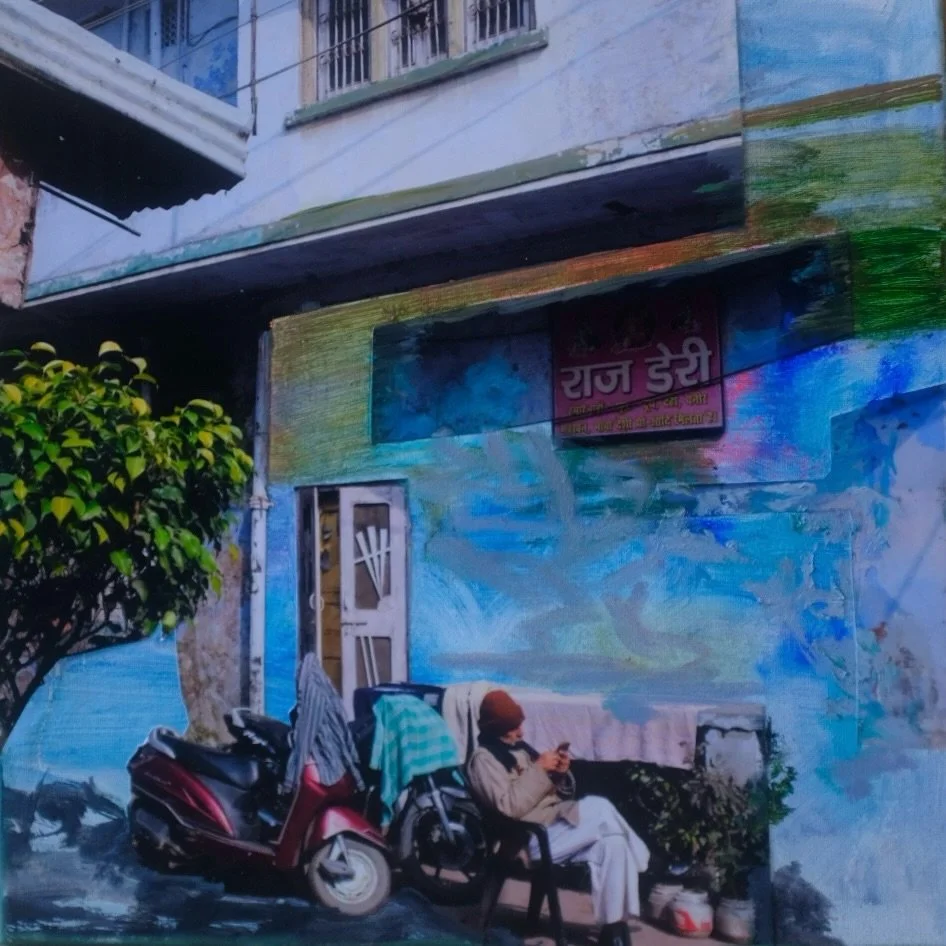 A single street of many 

Each street lives in layers -
painted walls, passing bikes, a man watching it all unfold.
Nothing asks for attention,
yet everything insists on being seen.
Here, life does not quiet itself.
It gathers, overlaps, continues.

