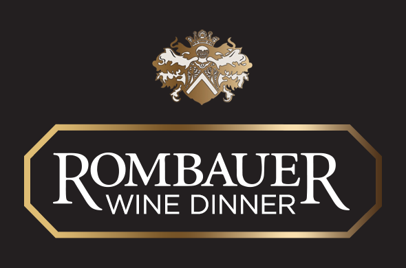 Rombauer Wine Dinner logo with gold and white family crest above the text ‘Rombauer Wine Dinner’ on a black background with gold border.