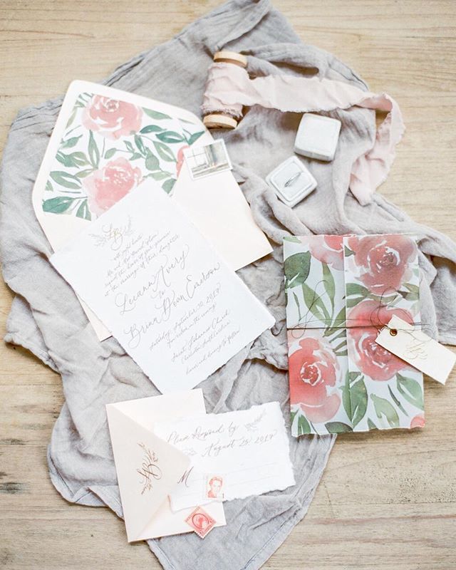 Flashback to this romantic suite featured in @thebridaltheory AND @heyweddinglady last spring! 🌷Vellum paper printed with a custom watercolor painting to wrap the suite, cloth tags with the couple&rsquo;s monogram, handmade paper, and vintage stamps