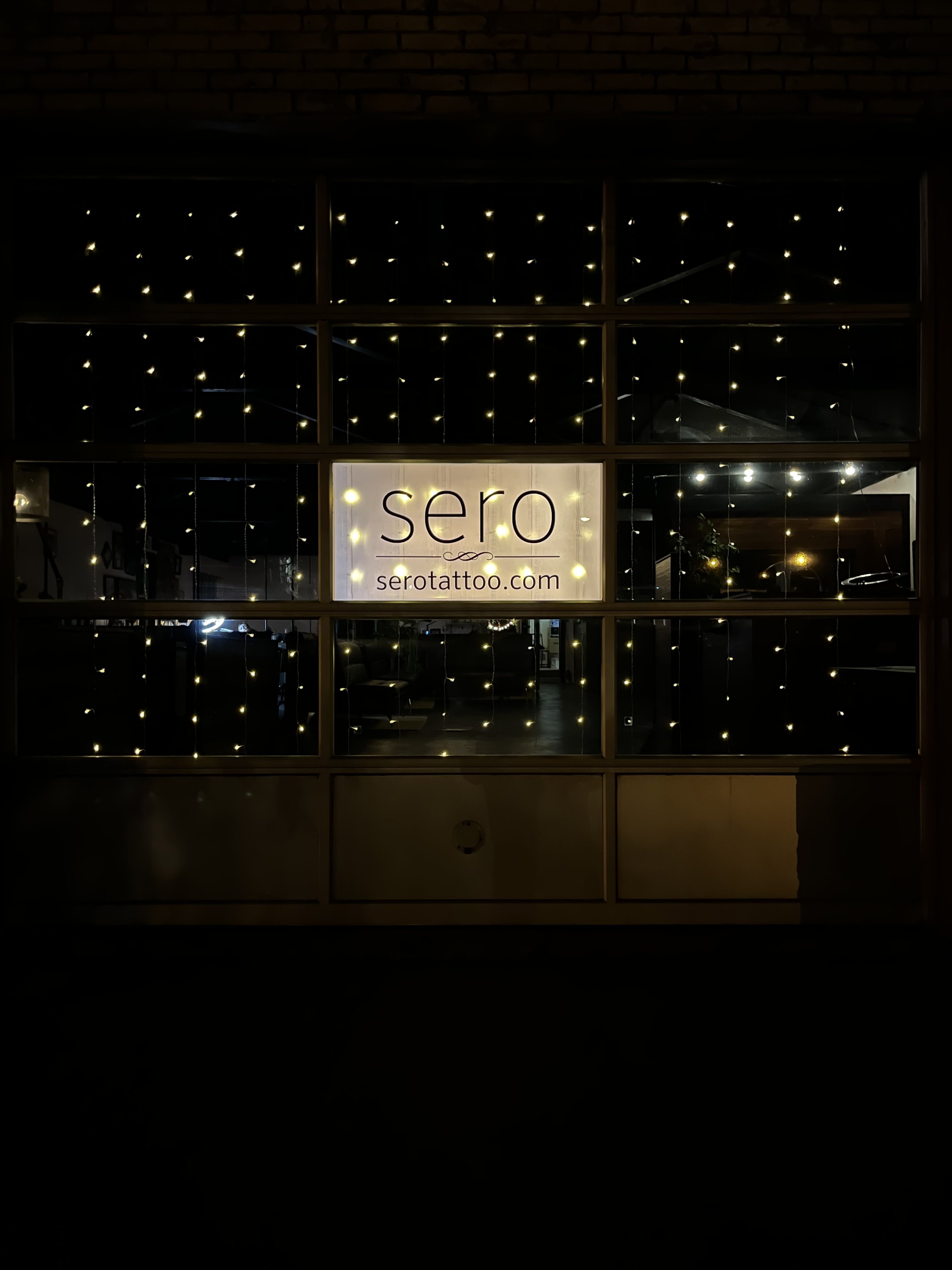 Front of shop at night