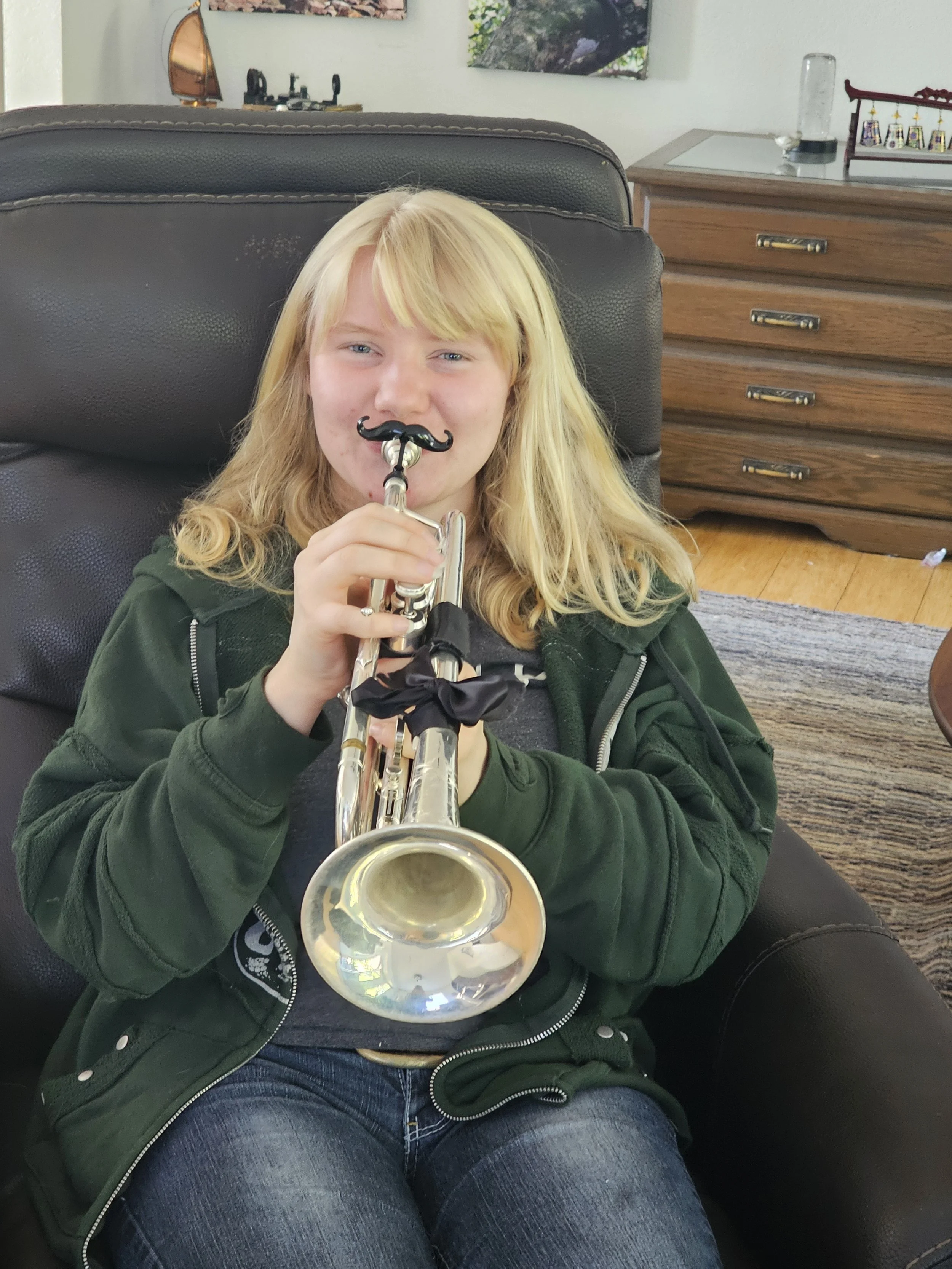 Having fun while playing her trumpet