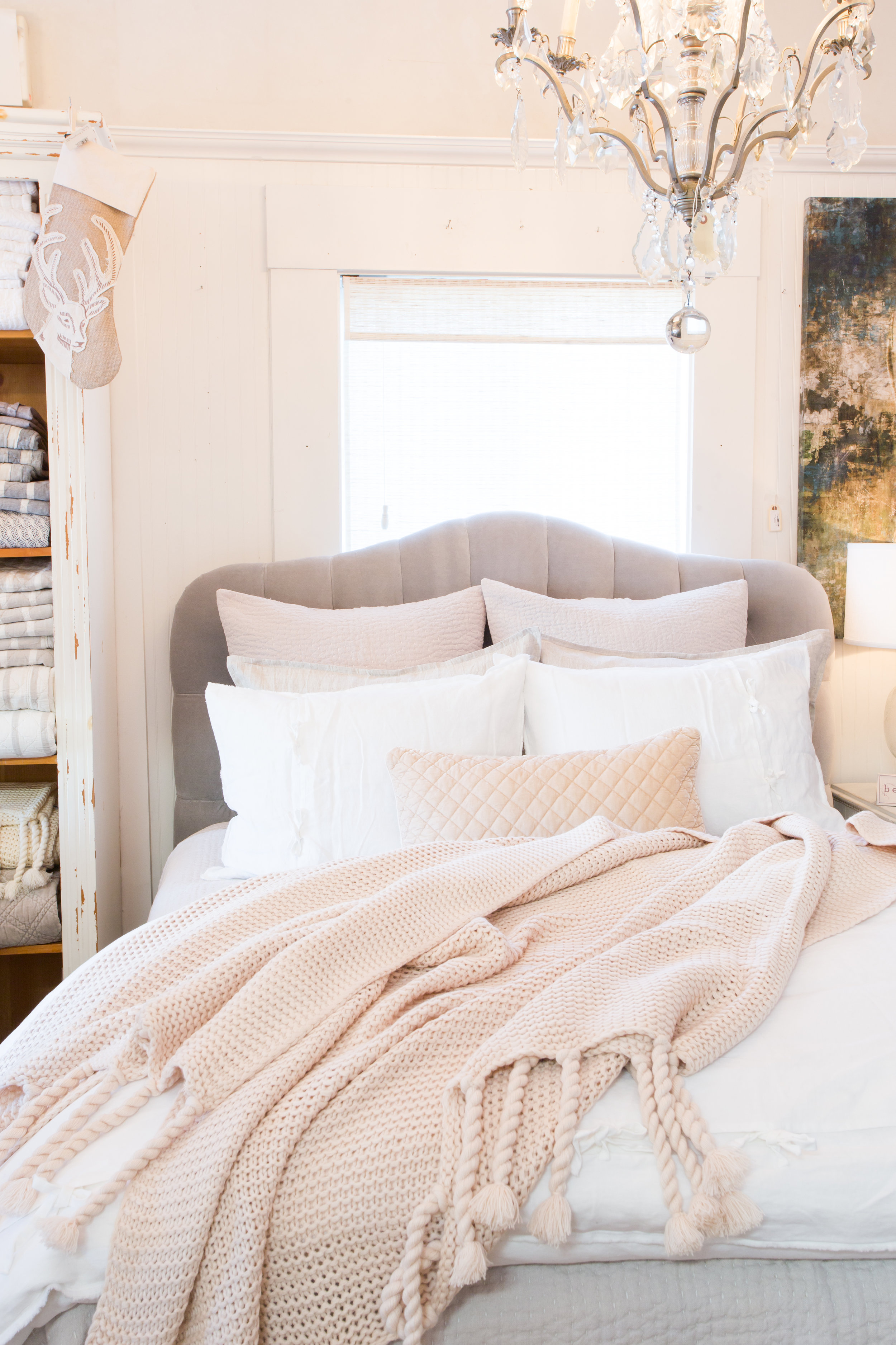 Cream bedding, blush coverlet