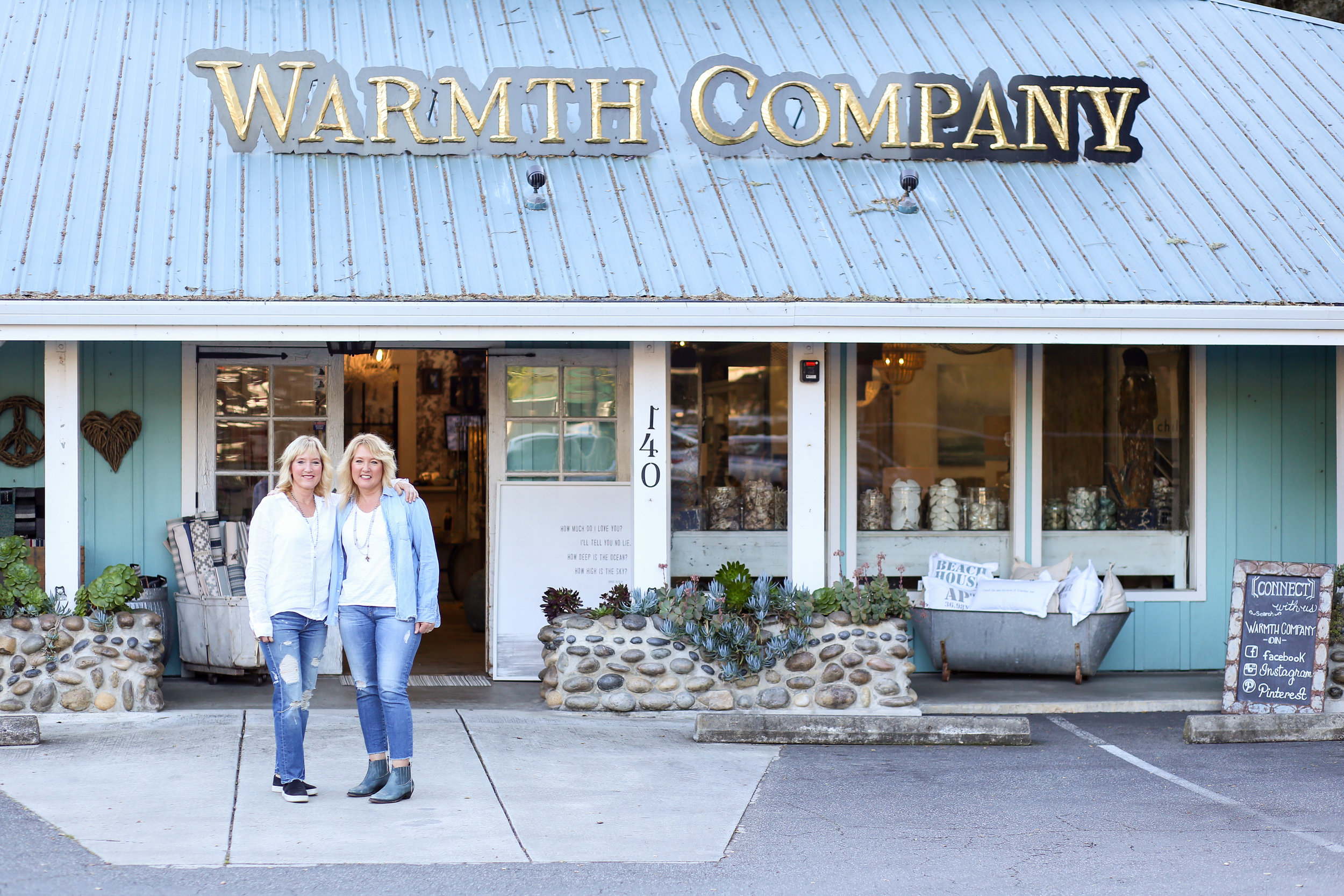 In front of Warmth Company storefront