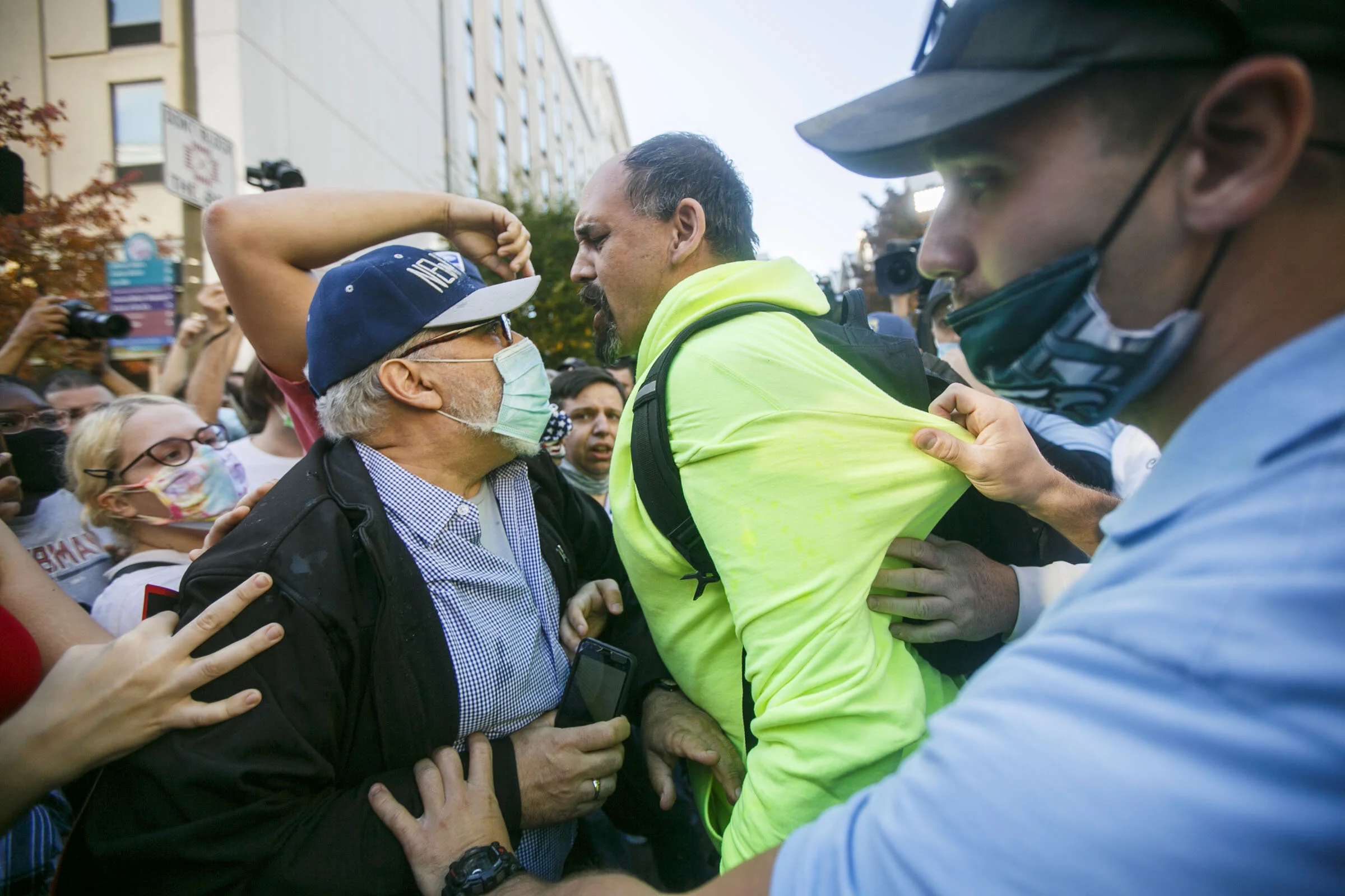  A Trump and Biden supporters clash during the 2020 presidential election result counting outside the Philadelphia Convention Center. 