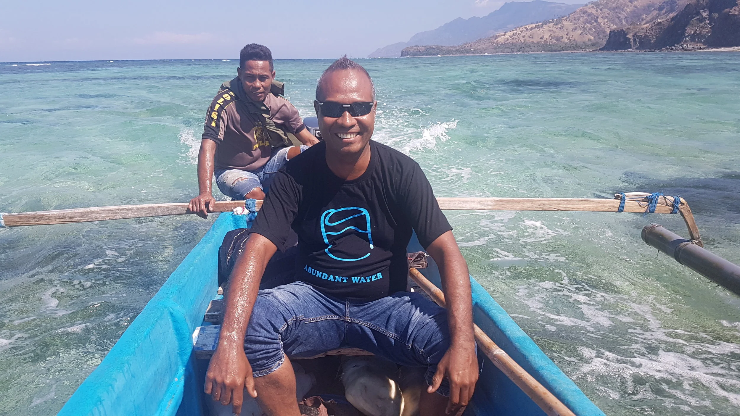 Simao da Costa, the AW Program Manager for Timor-Leste (front), travelling up the coast of Atauro Island.