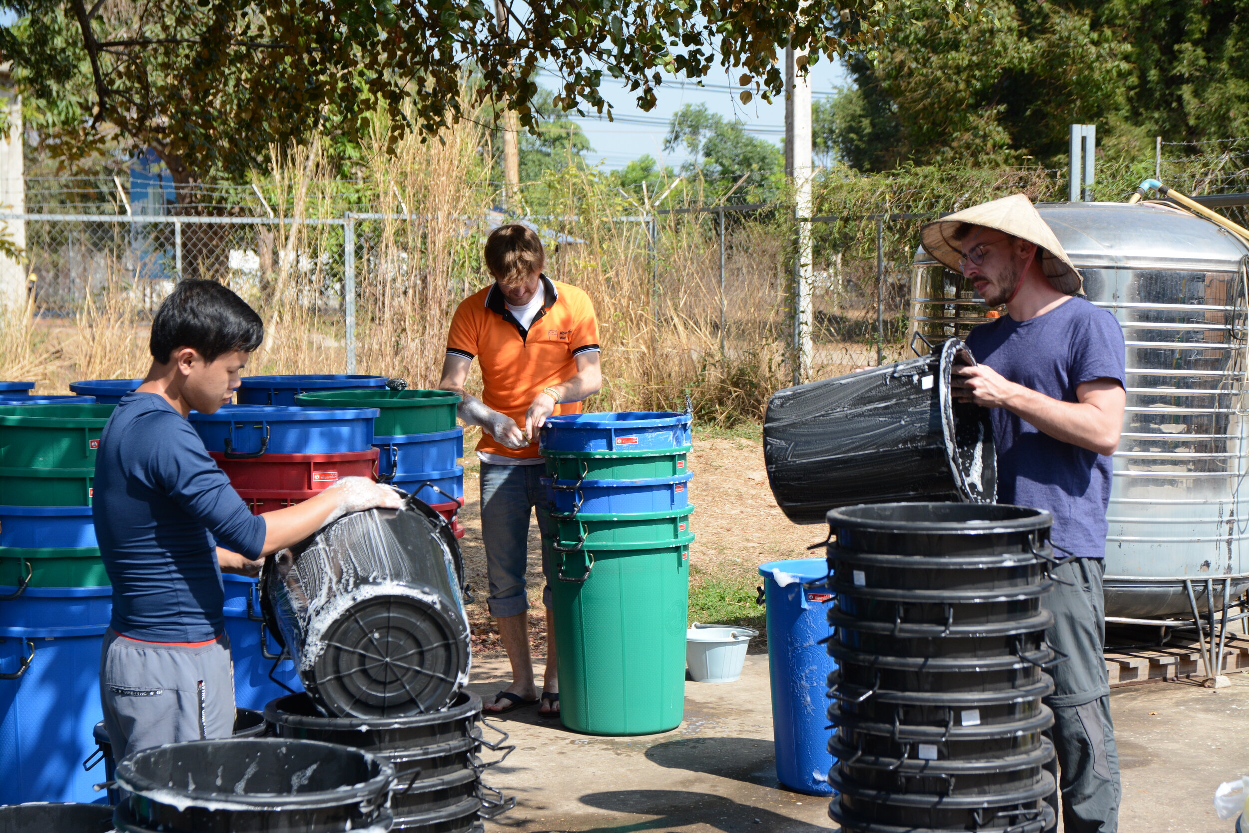   Kamkheo, Keith and Florian washing the buckets  