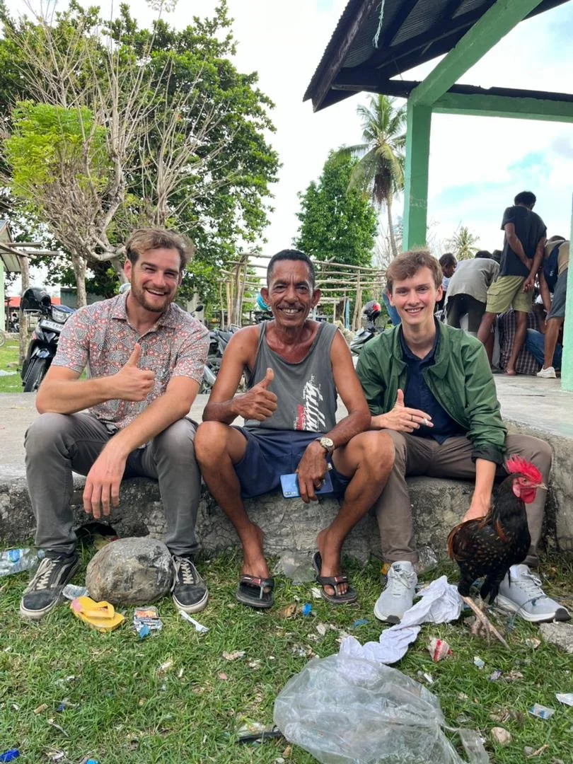 John and outgoing Abundant Water Timor-Leste program supervisor Chris Draper, meeting with potential customers and vendors at a "manu-futu" (cockfighting) event in Salele, Cova Lima municipality, Timor Leste