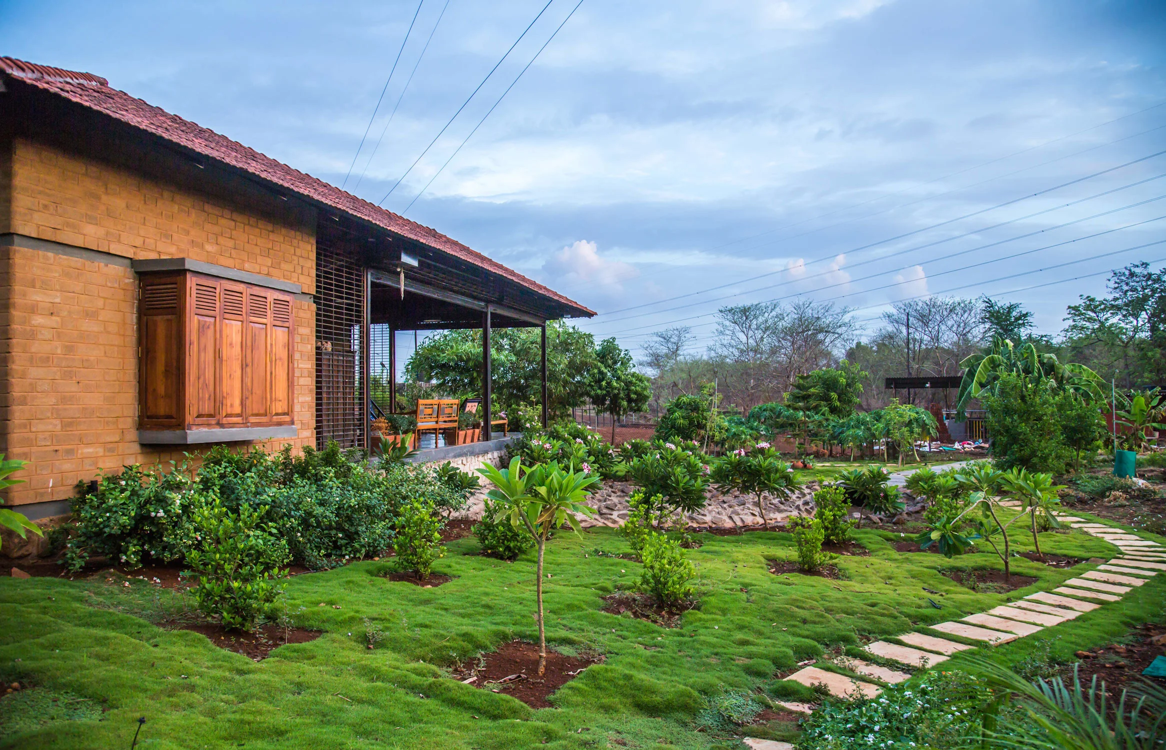 Nirvana Farmhouse, Khadavli Built from CSEB, enveloped around a courtyard, the traditional plan transforms into a modern weekend home located on the banks of river Ulhas. 