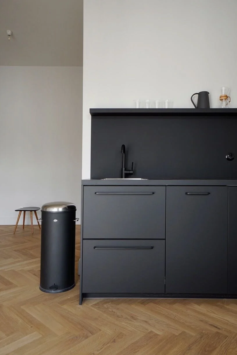 This 45 m² apartment was completely raw when we found it. We rebuilt it from scratch, merging original 1905 character with a calm, contemporary minimalism.